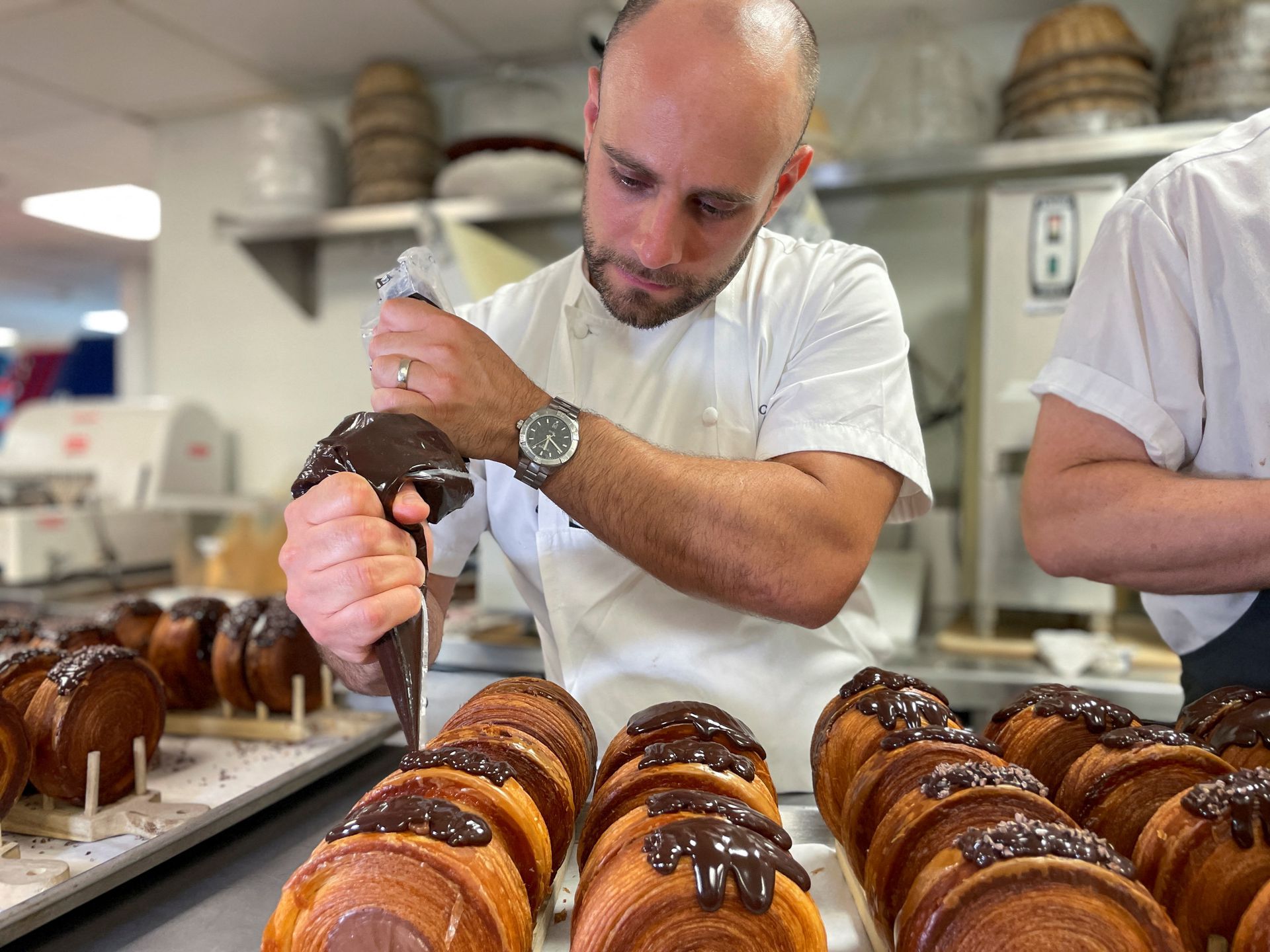 Lafayette Grand Cafe & Bakery executive pastry chef Scott Cioe works on the preparation of Supremes, at Lafayette Grand Cafe & Bakery, in New York, Aug. 24, 2022.