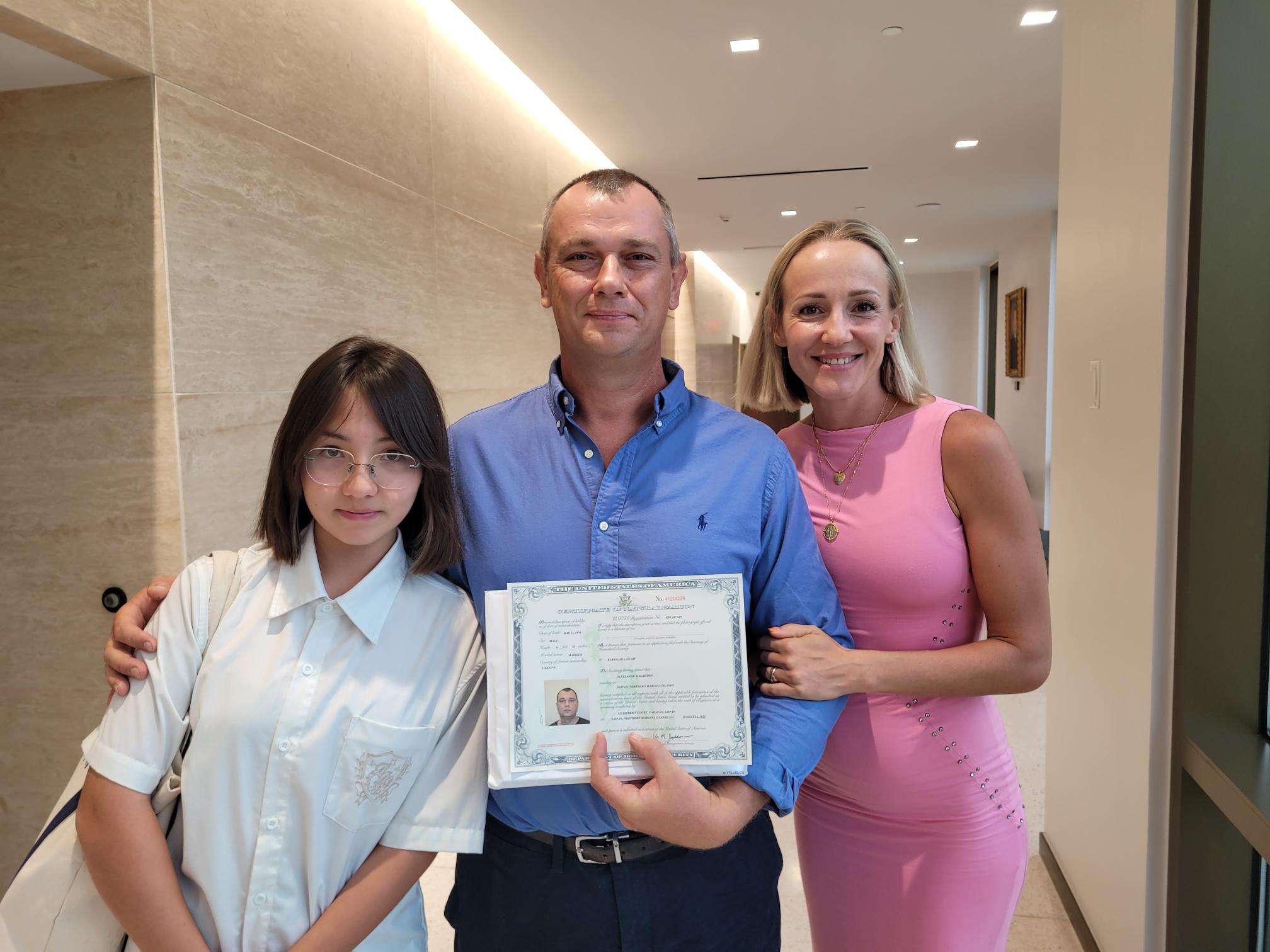 Oleksandr Galadzhii, his wife Ksenia Lizunova, and daughter Eva at the District Court for the NMI after the naturalization ceremony on Monday.