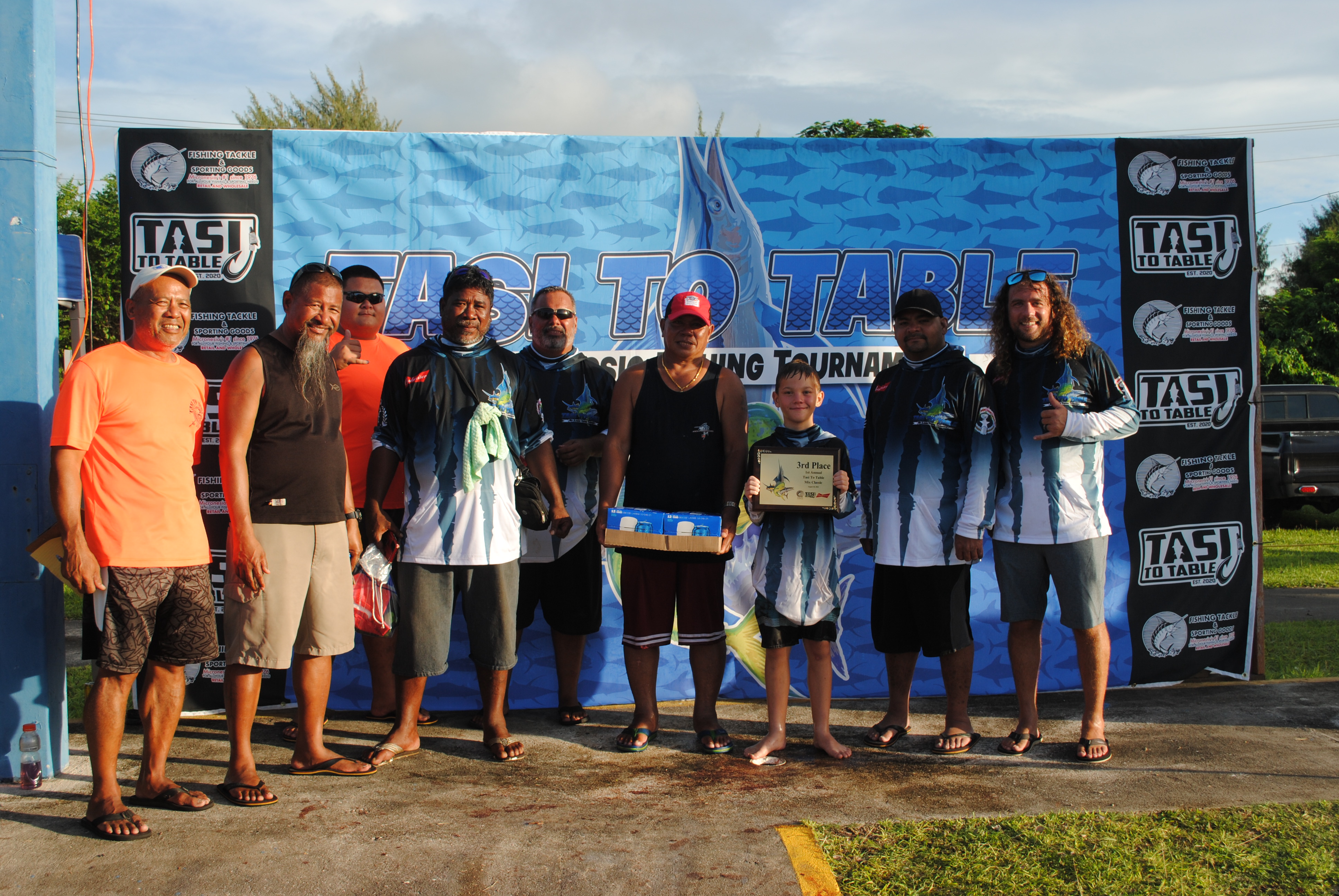 The crew of Handline II, which finished third, poses  for a photo with Tasi To Table officials at the conclusion of the 1st Annual Mix Classic on Saturday at Smiling Cove Marina.  