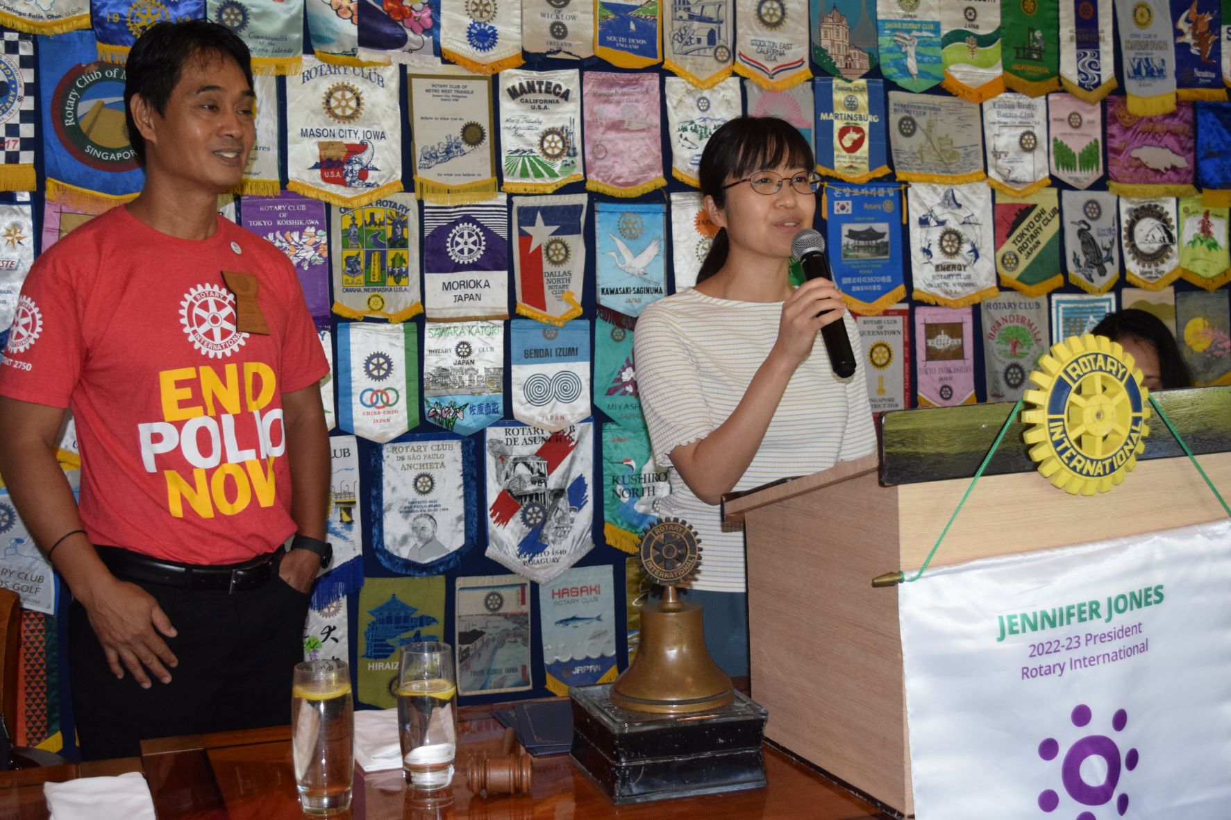 University of California Irvine Doctorate in History candidate Ayuko Takeda, rights, speaks during the Rotary Club of Saipan meeting Tuesday at the Hyatt’s  Giovanni’s Restaurant as club president Wendell Posadas looks on.