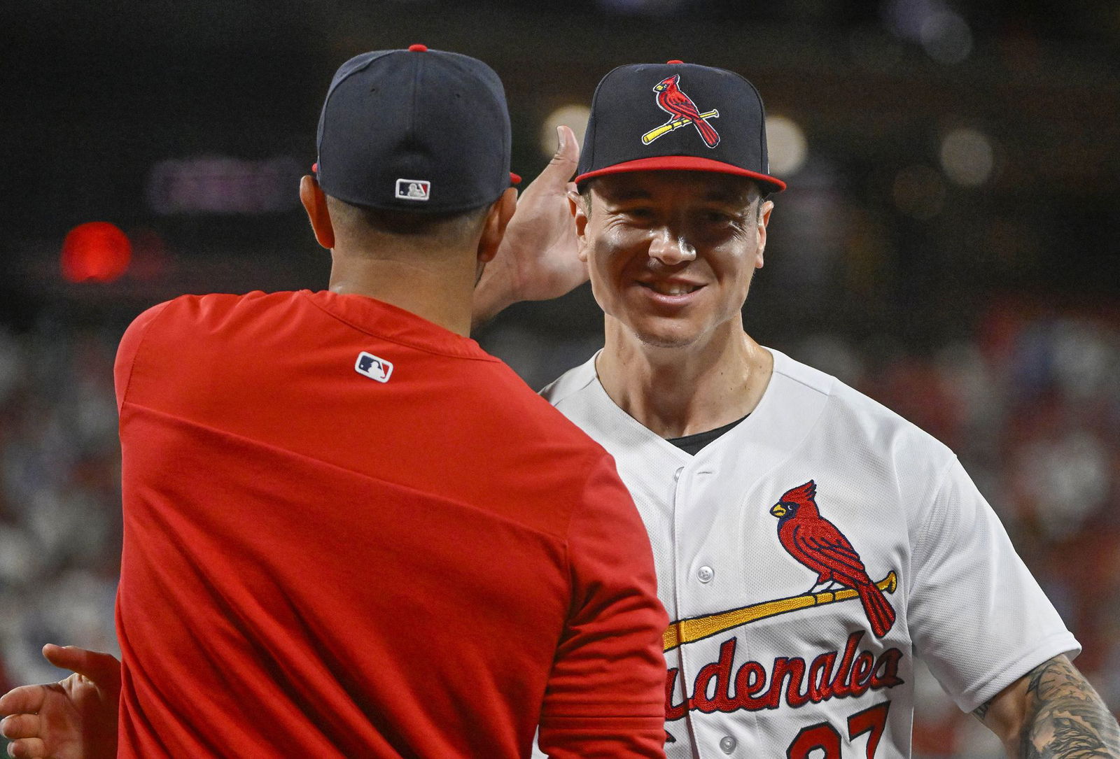 St. Louis Cardinals left fielder Tyler O'Neill (27) celebrates with manager Oliver Marmol (37) after the Cardinals defeated the Atlanta Braves at Busch Stadium in St. Louis, Missouri, Aug. 28, 2022.