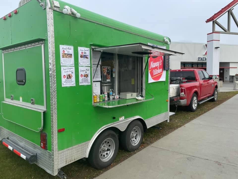 Nanay's Kitchen food truck is  parked outside of the Exchange in Alaska.