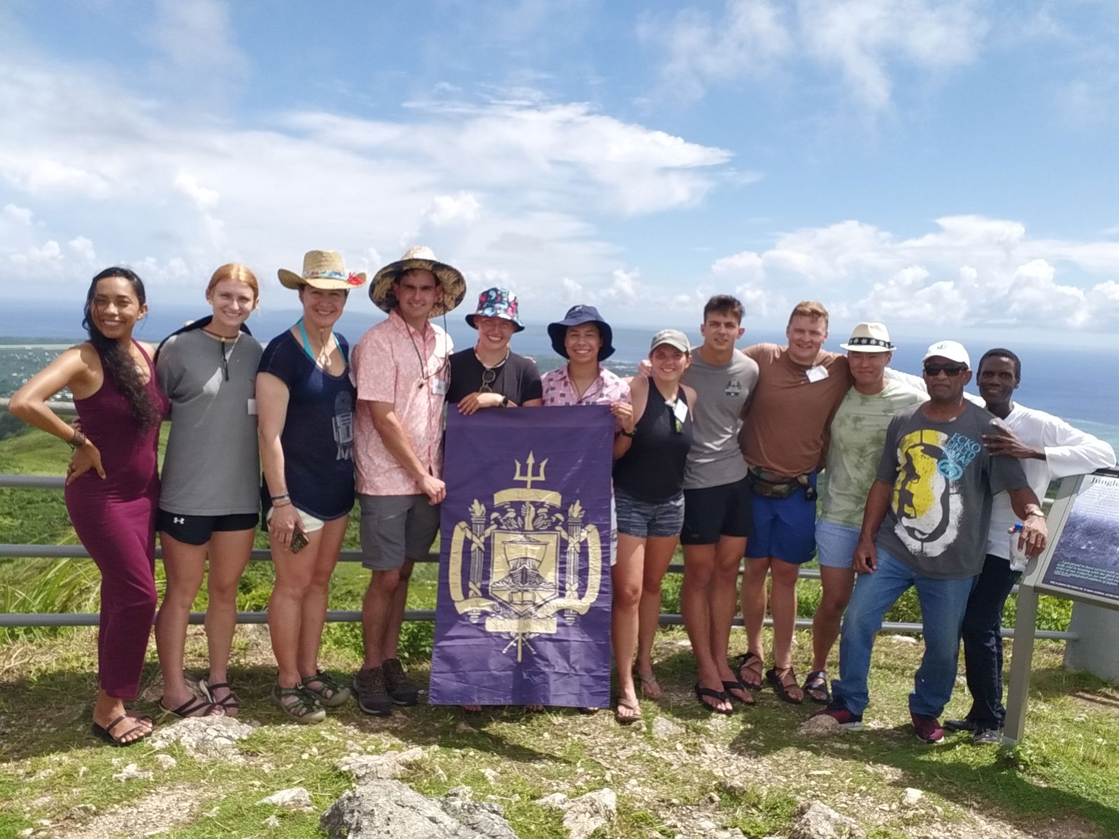 On Mount Tapochau, from left, Eva Chamorita, guest guide and contributor to Latte in the Marianas book, Ava Izenour, Col. Maria "MJ", Pallotta, PhD., Aidan Otero, Ellie Dabney, Molly Mangan, Becca Vavasseur, Charlie Sewell, Carson Hillier, Capt. Bob Qu, Willy Kaitabu and Walt F.J. Goodridge, guide.