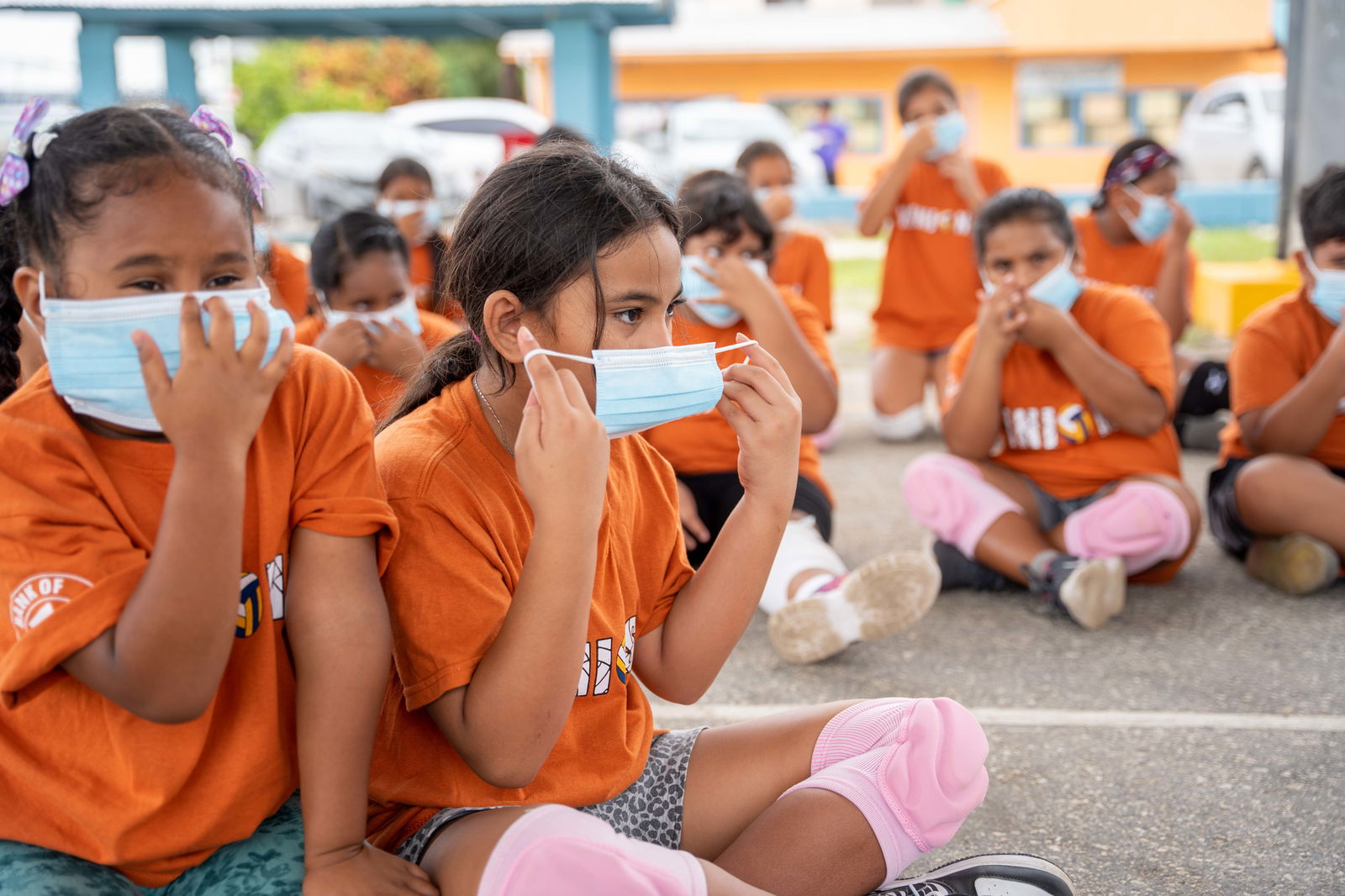 Marshall Islands children taking part in a volleyball program last week in Majuro were given instructions on face mask wearing as the country prepares for its first-ever Covid wave.