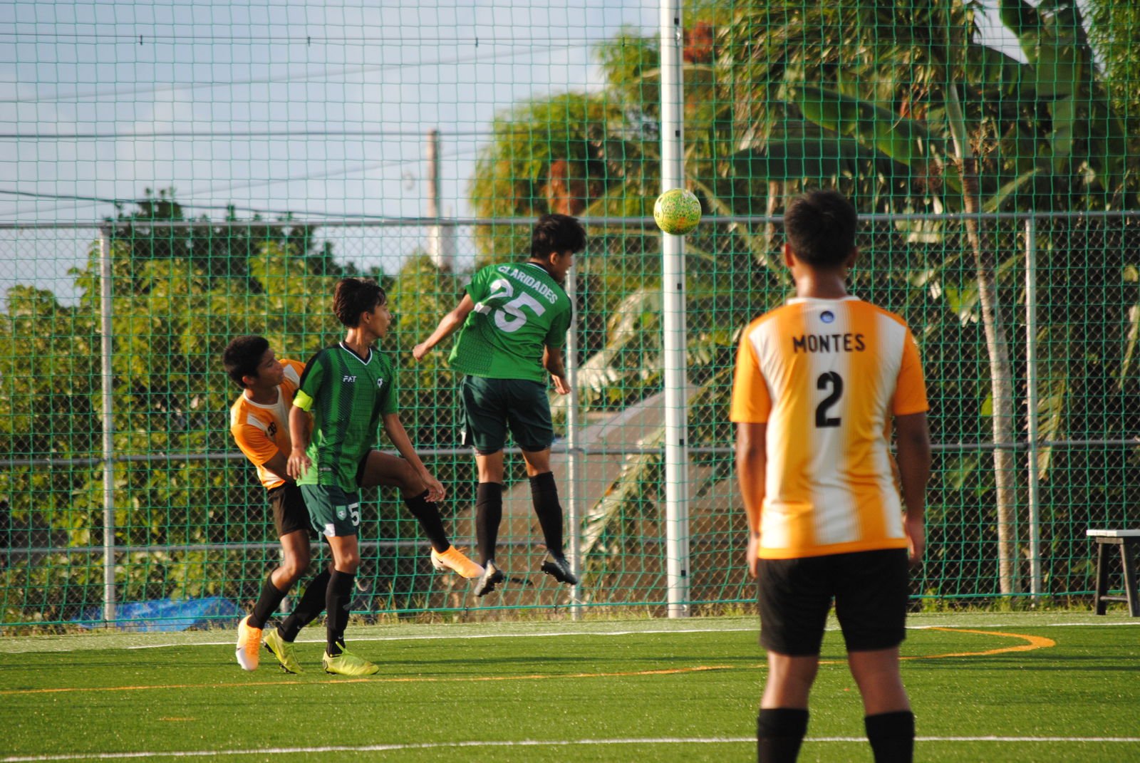 Tan Holdings’ Monico Claridades connects the header for the interception.
