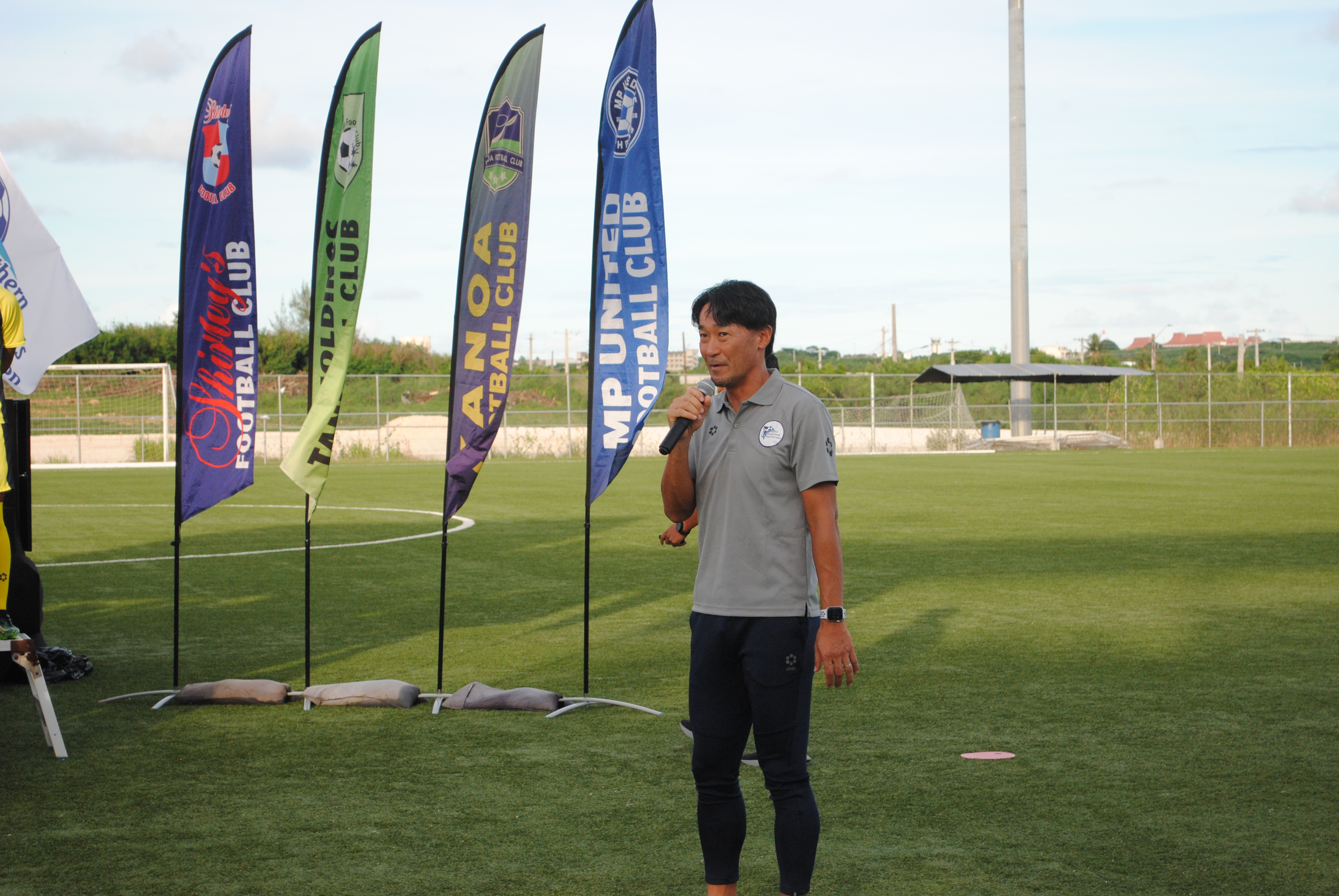 Head Coach Michiteru Mita delivers his remarks during a sendoff ceremony for  the NMI Men's U20 National Team on Friday at the NMI Soccer Training Center.