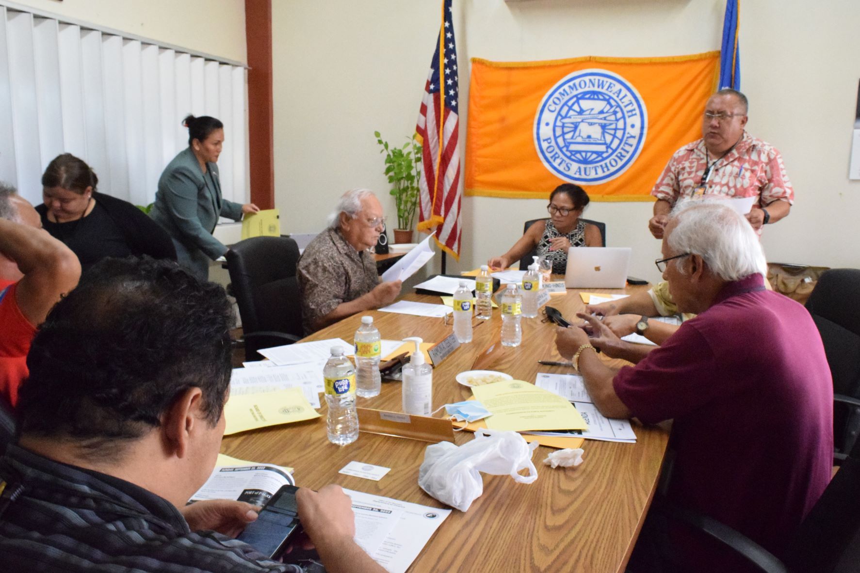 Commonwealth Ports Authority Executive Director Christopher Tenorio, right standing, reports to the CPA board during a meeting last week in the CPA conference room.