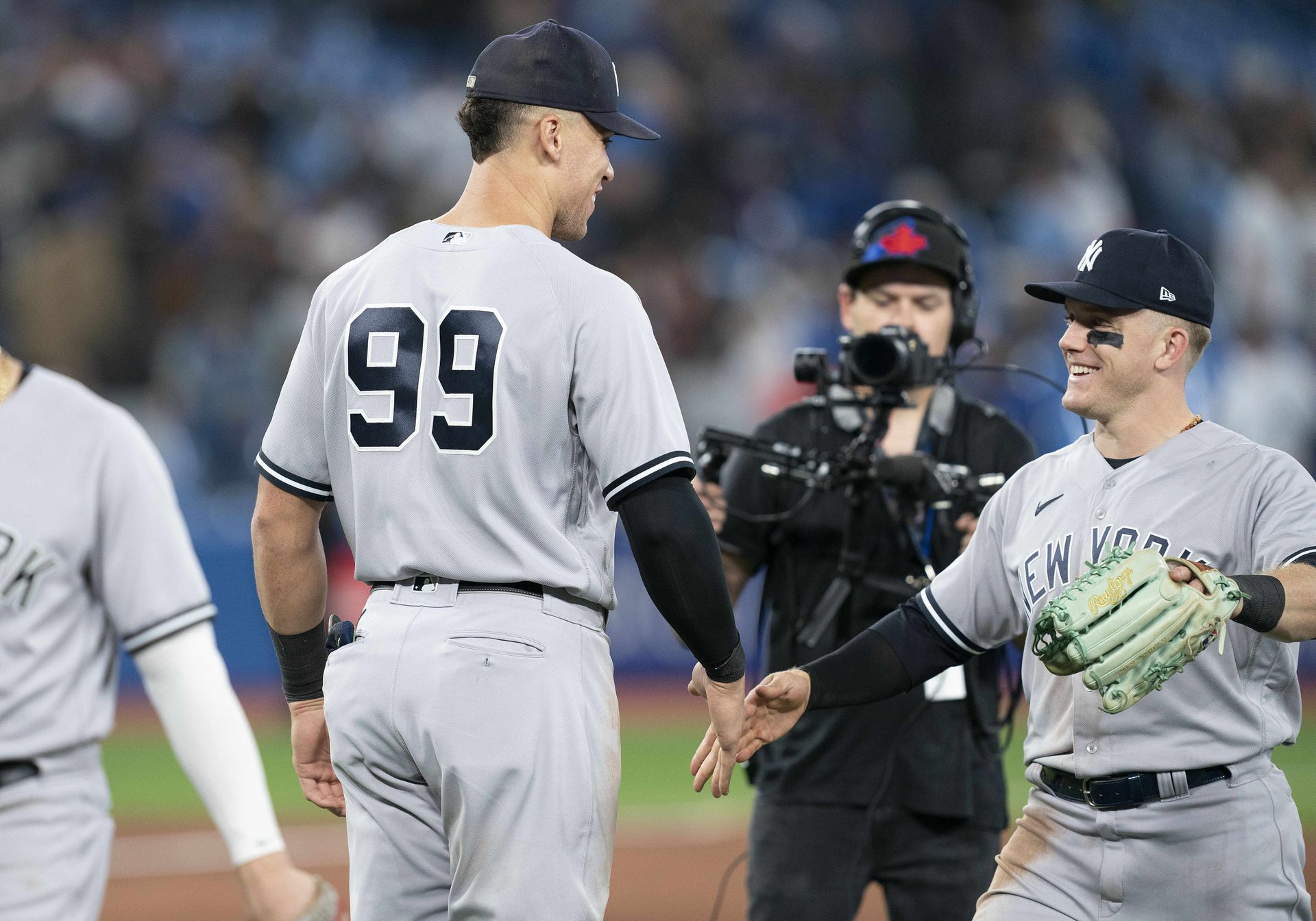 New York Yankees designated hitter Aaron Judge (99) celebrate the win with New York Yankees center fielder Harrison Bader (22) at the end of the ninth inning at Rogers Centre in Toronto, Ontario, Canada, Sept 28, 2022.
