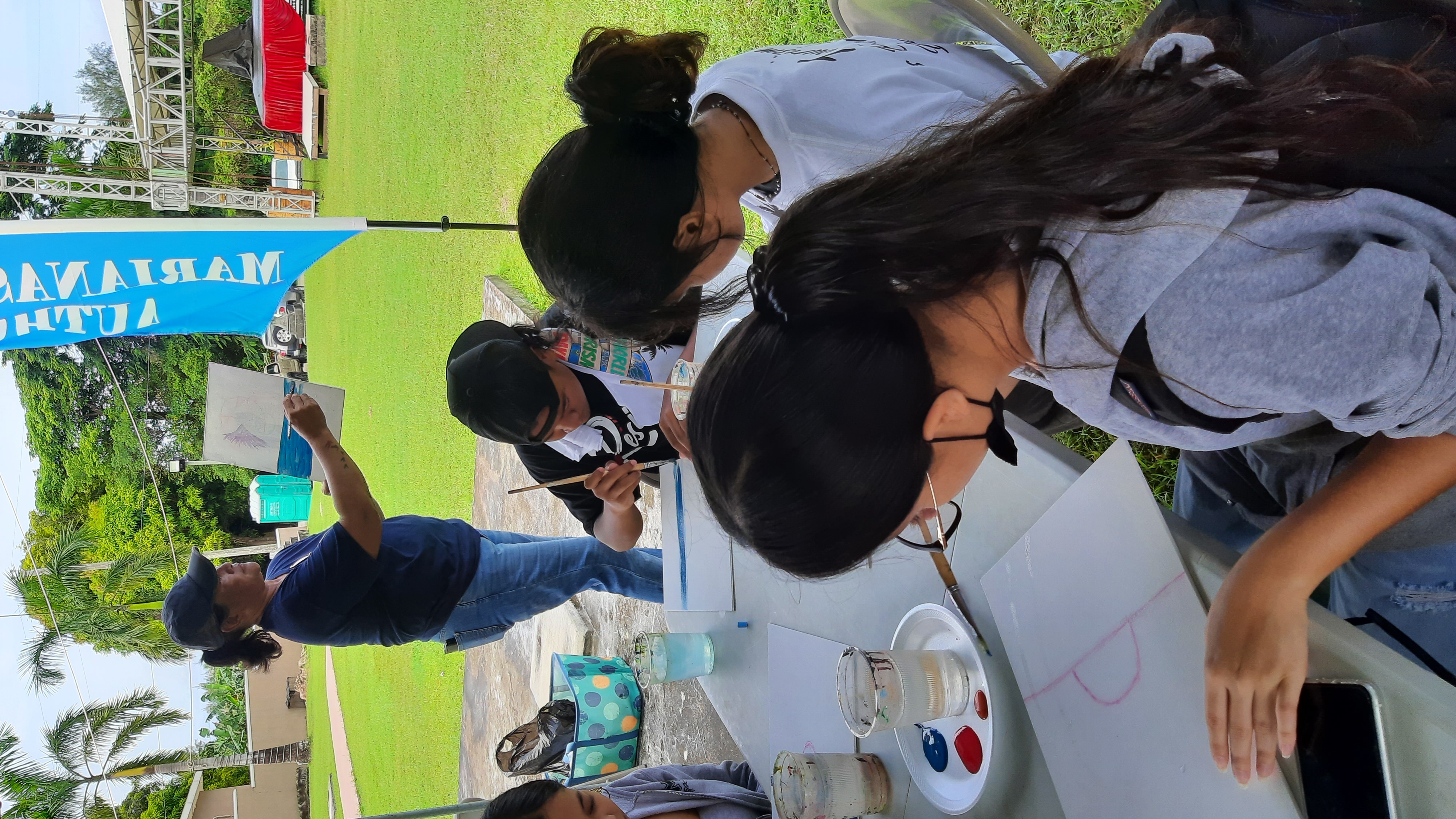 Local artist Linda Concepcion Torres conducts a painting class with MY WAVE (Marianas Youth Welcome All Visitors Enthusiastically) Club students during World Tourism Day on Sept. 27, 2022, at the Northern Mariana Islands Museum of History & Culture in Garapan, Saipan.