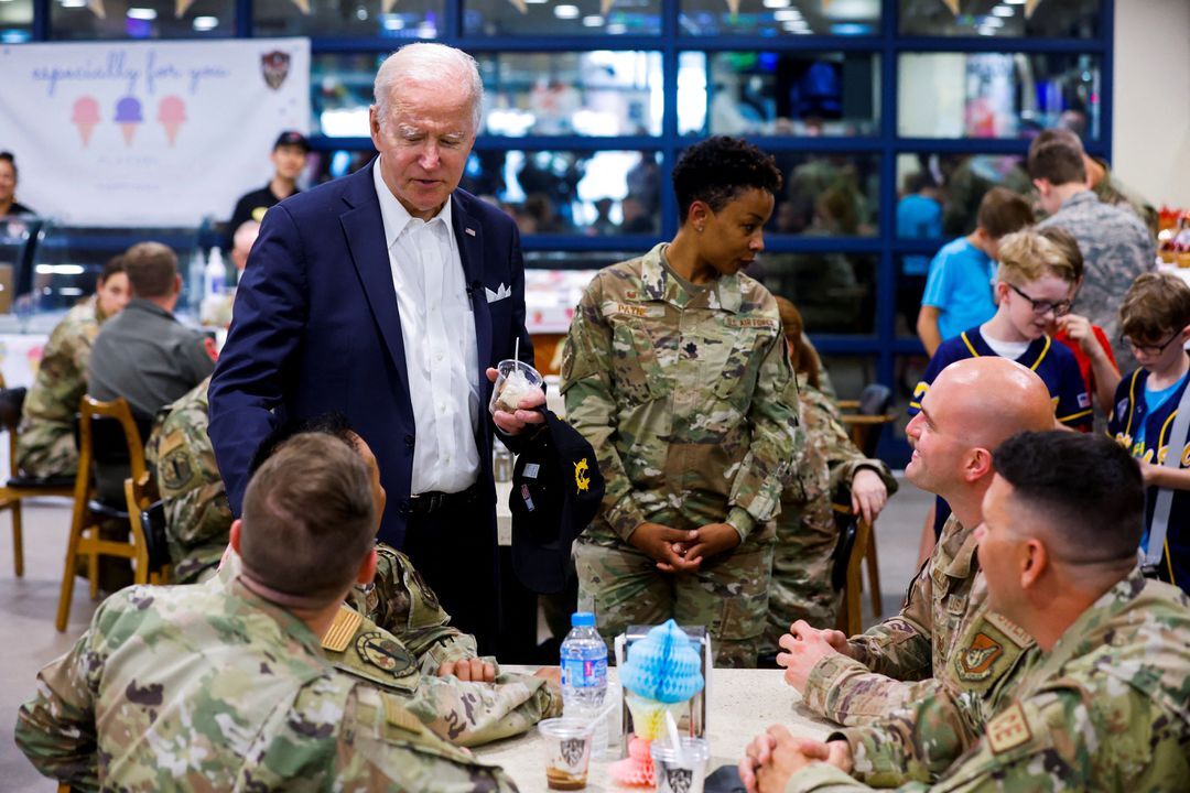 President Joe Biden has an ice cream as he greets U.S. troops during his visit to the Air Operations Center at Osan Air Base in Pyeongtaek, South Korea, May 22, 2022.