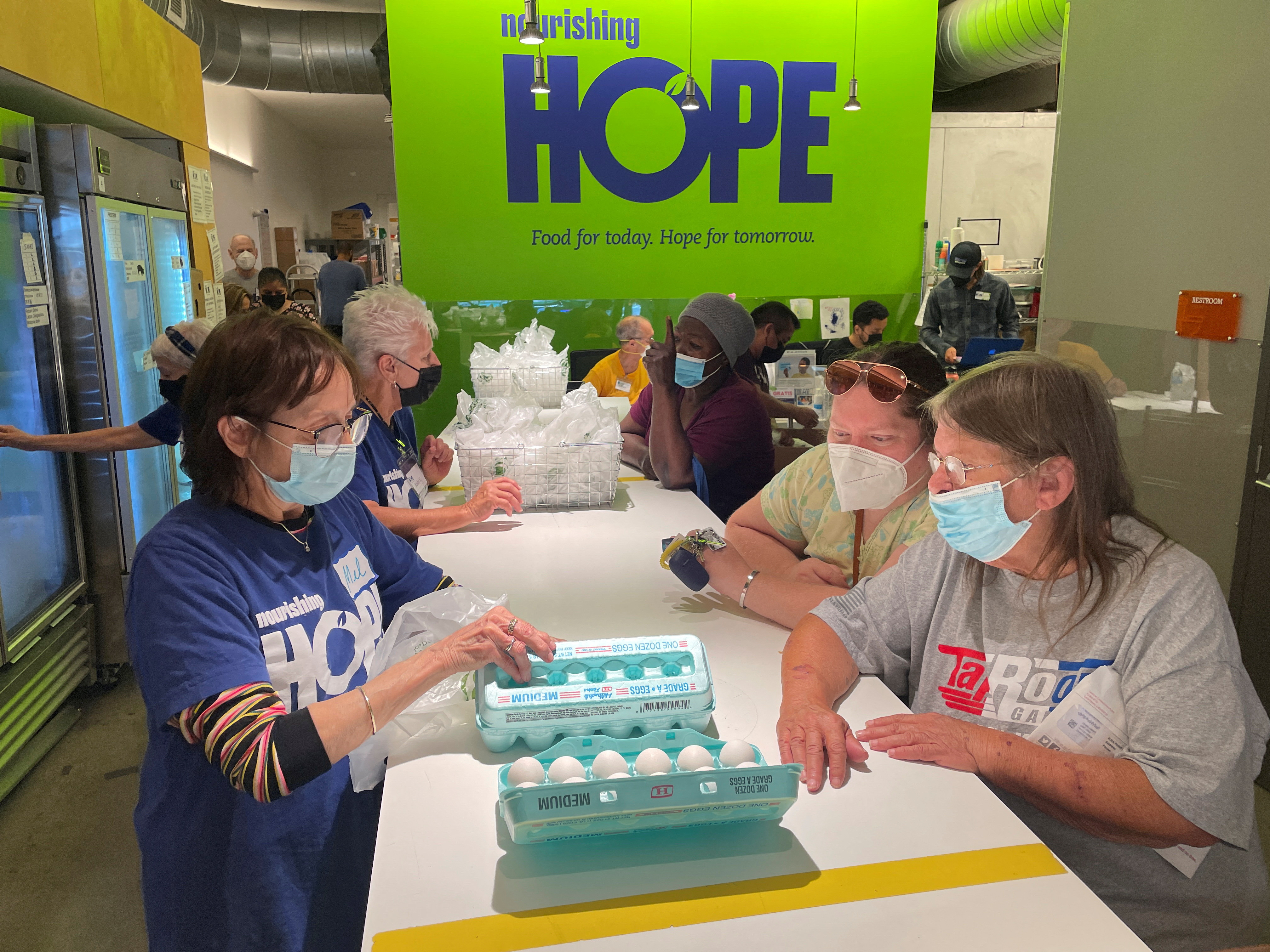 People get free groceries at nourishing hope food pantry in Chicago, Illinois, Aug. 29, 2022.