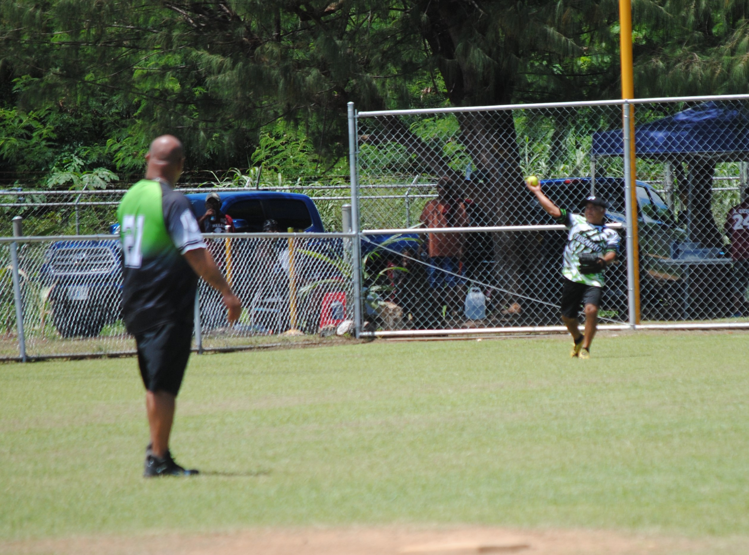 Tokahao's right outfielder Alvin Takai throws the ball infield during a 2022 Budweiser Belau Amateur Softball League game at the Dandan baseball field.