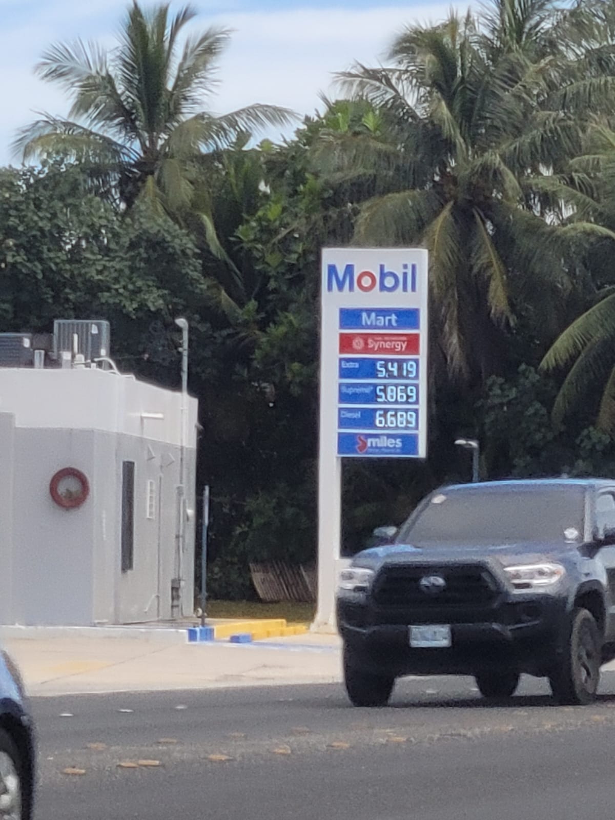 The Mobil Oil station in Chalan Kiya displays its new prices on Friday.
