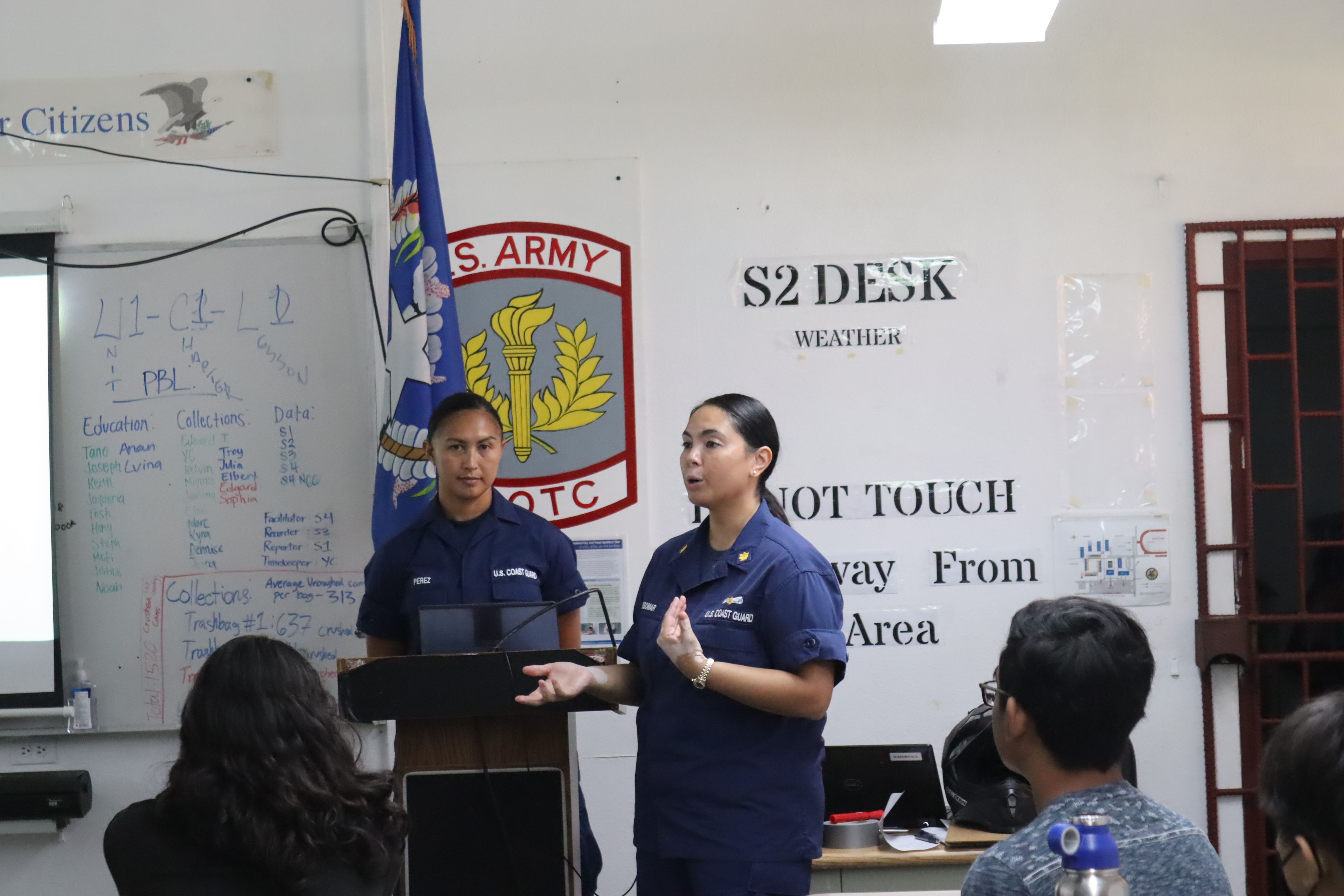 Lt. Cmdr. Christine Igisomar speaks to the cadets about the Coast Guard