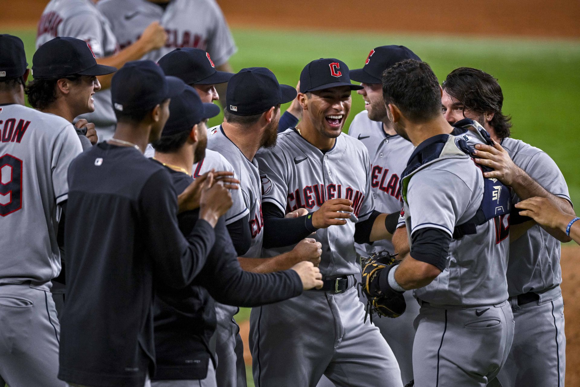 The Cleveland Guardians celebrate on the field after they clinch their first AL Central title since 2018 after the victory over the Texas Rangers at Globe Life Field in Arlington, Texas,  Sept. 25, 2022.