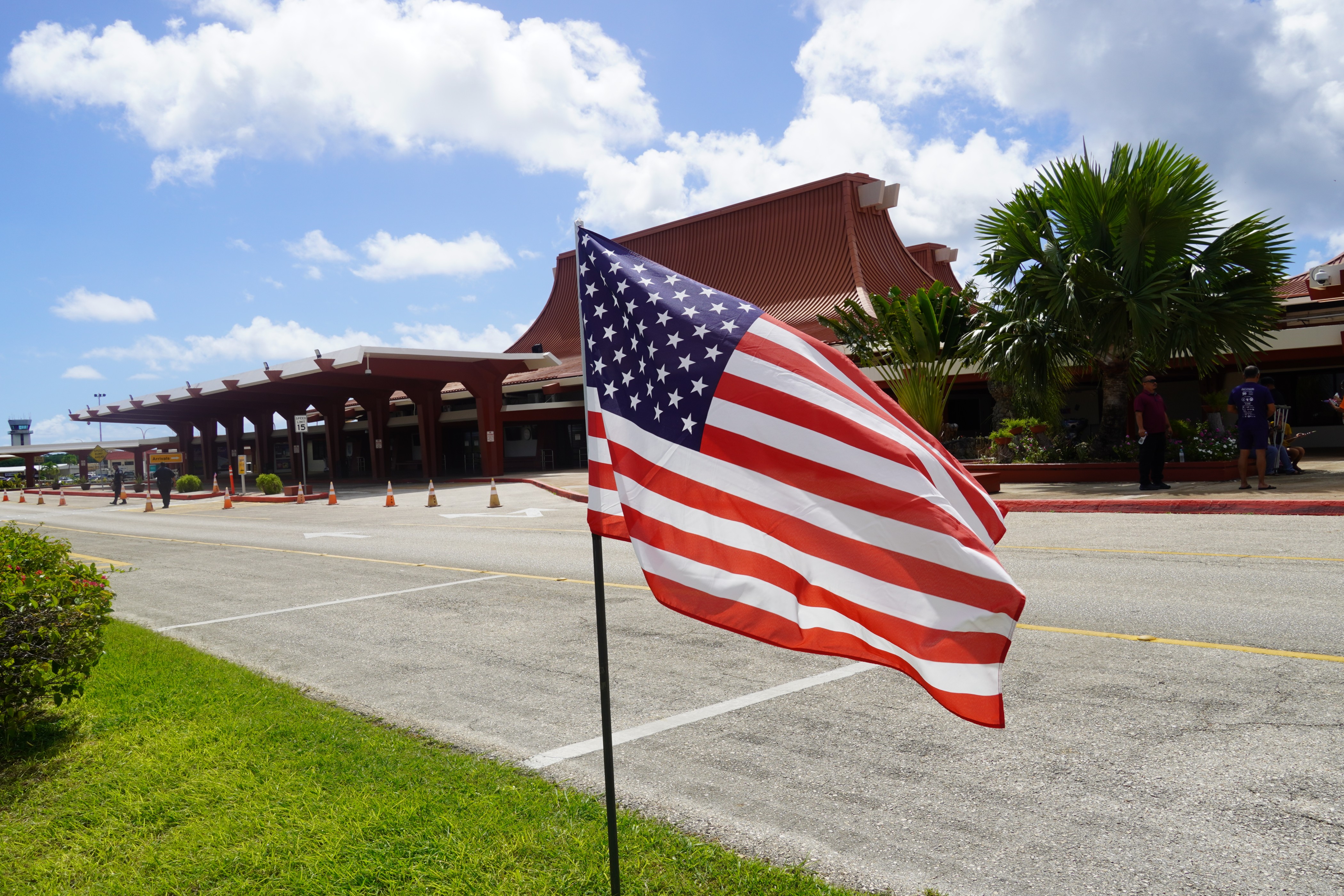 A U.S. flag waves at the Francisco C. Ada/Saipan International Airport on Saturday morning.