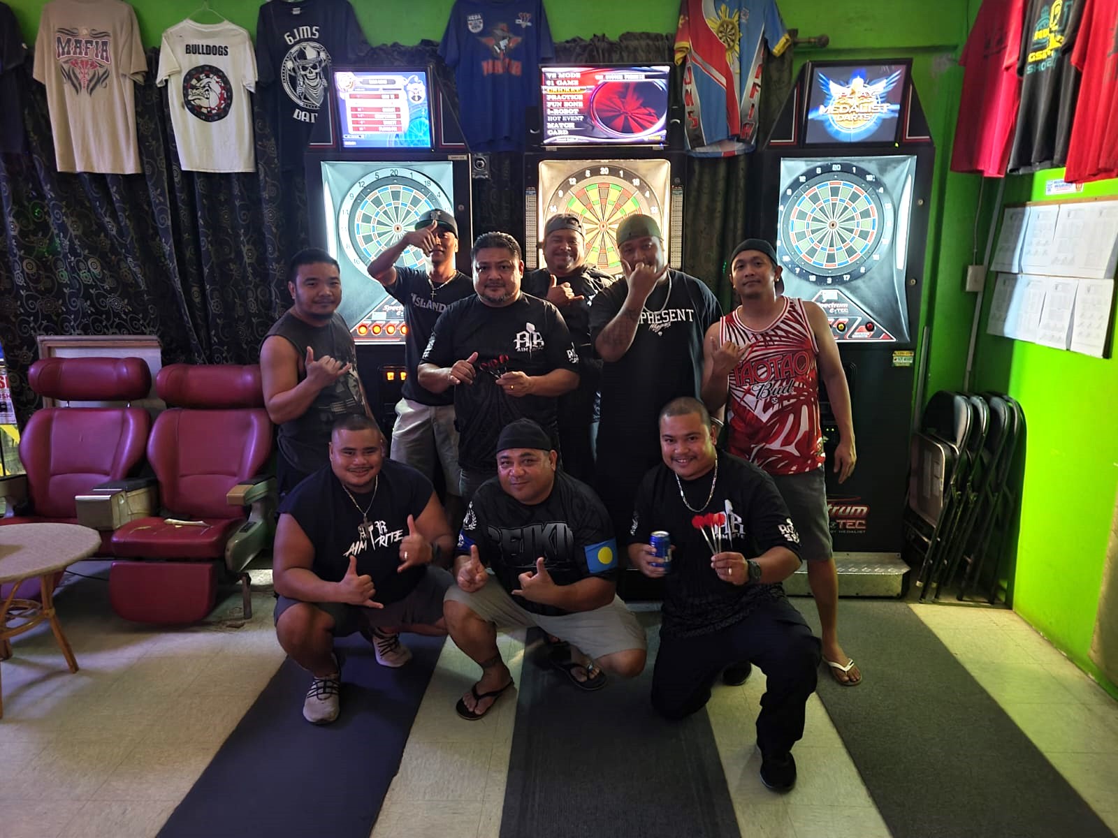 6JMS Champinos and Oleai Aimrite pose for a photo  after their match in the Tuesday Latte Stone “B” Division of the SEDA Bud Light Dart League at 6JMS Sports Bar.