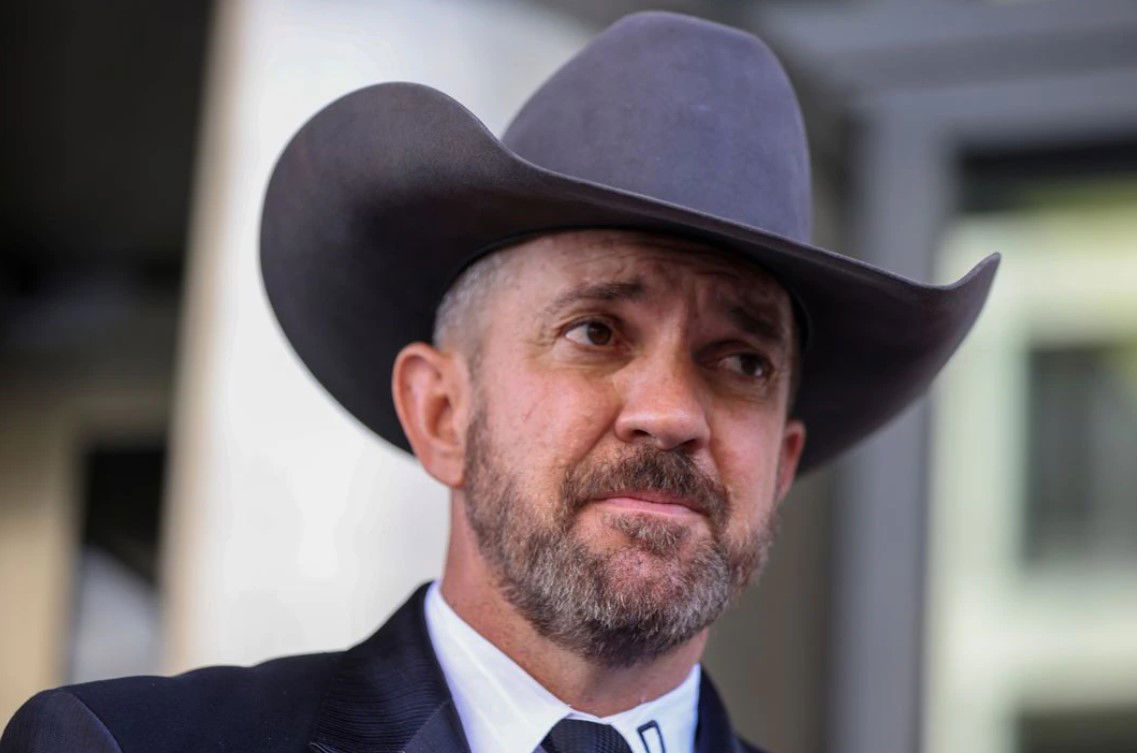 Couy Griffin, founder of "Cowboys for Trump" organization and commissioner of Otero County, New Mexico, looks on as he speaks to media after leaving federal court in Washington, D.C., June 17, 2022.