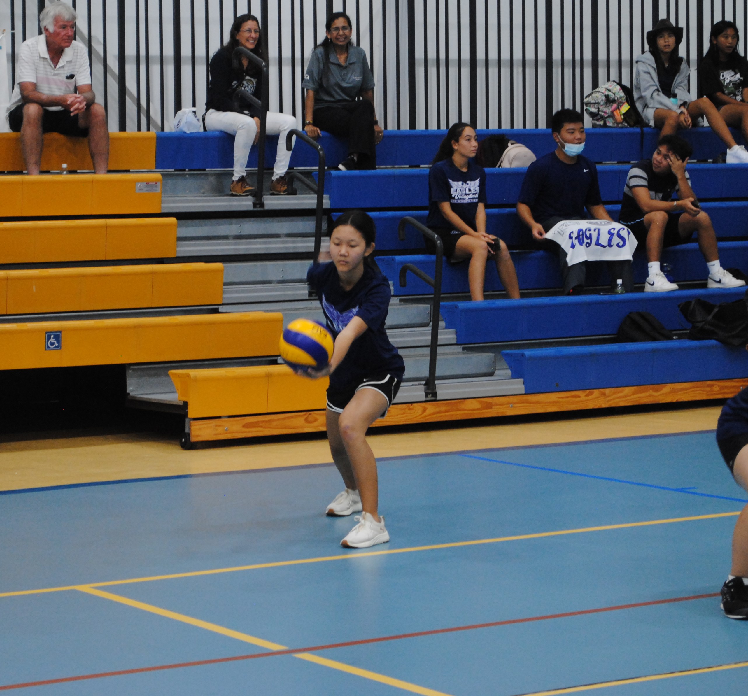 GCA JV's Eunji Hahn attempts the underhand serve during a PSS-NMIVA Girls High School Volleyball game Thursday at the MHS Gym.
