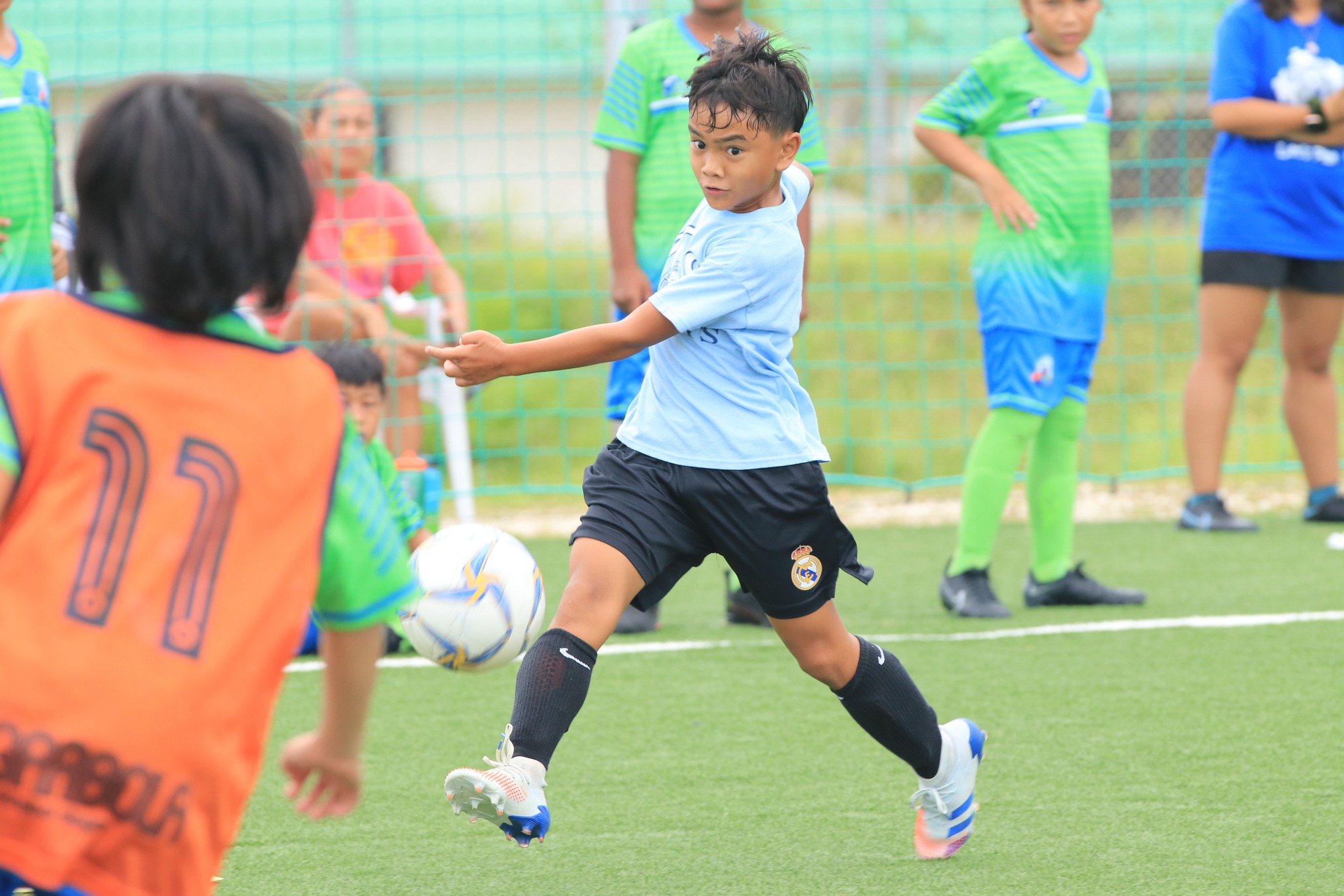 An MCS player attempts the midrange shot during an Elementary School Division game of the NMIFA-PSS Interscholastic Soccer League at the NMI Soccer Training Center.