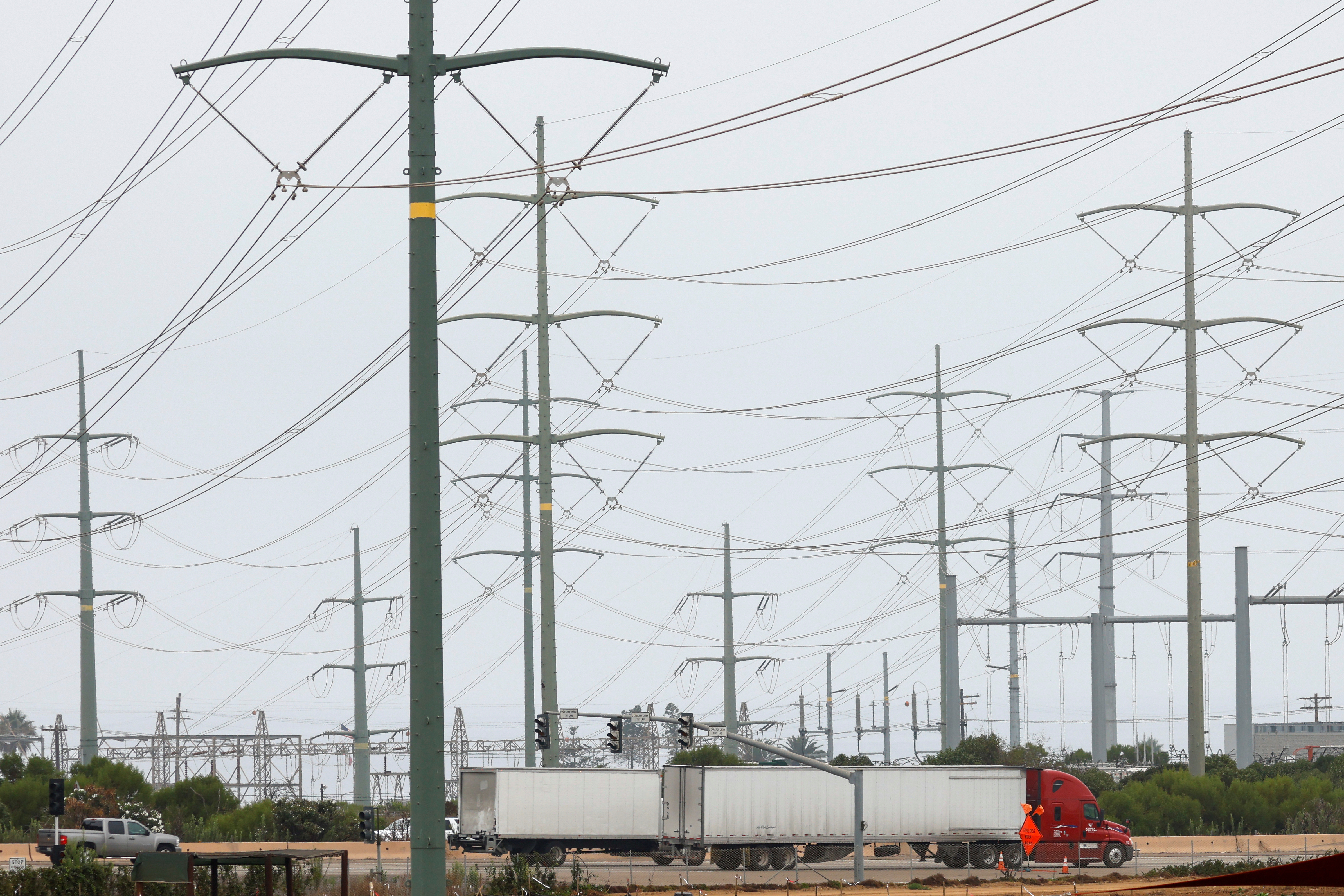 Power lines are shown as California consumers prepare for more possible outages following weekend outages to reduce system strain during a brutal heat wave amid the outbreak of coronavirus disease in Carlsbad, California, Aug. 17, 2020.