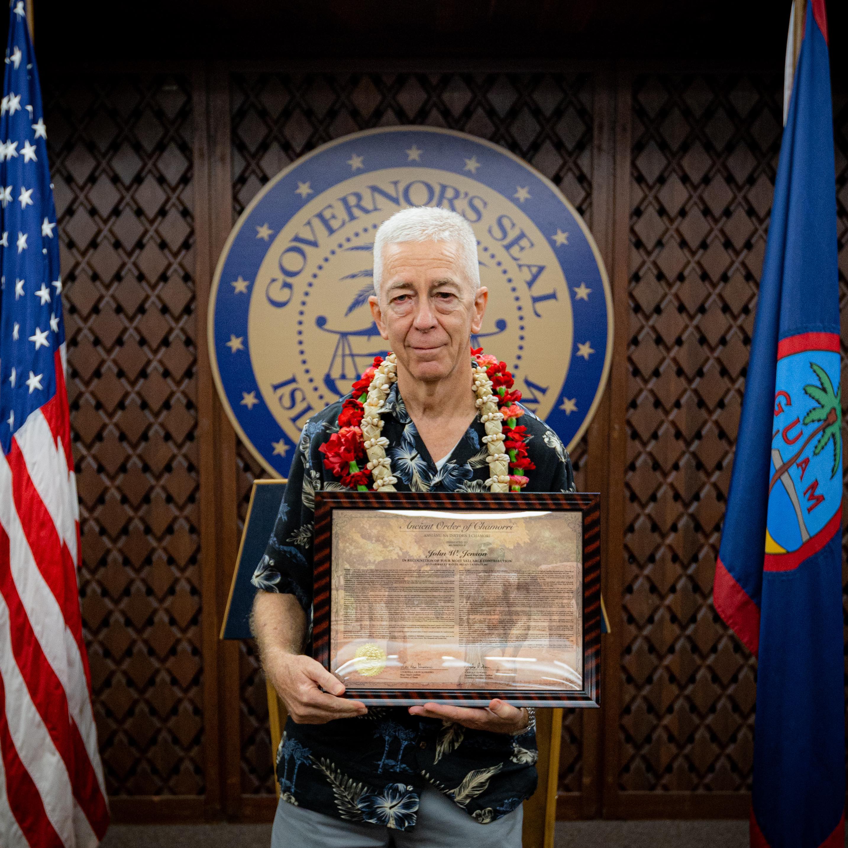 John W. Jenson, director and chief geologist of the Water and Environmental Research Institute of the Western Pacific at the University of Guam, receives the Ancient Order of the Chamorri Award — the highest honor that the Guam governor can give — during a ceremony at the Ricardo J. Bordallo Governor’s Complex in Adelup on Sept. 26. 