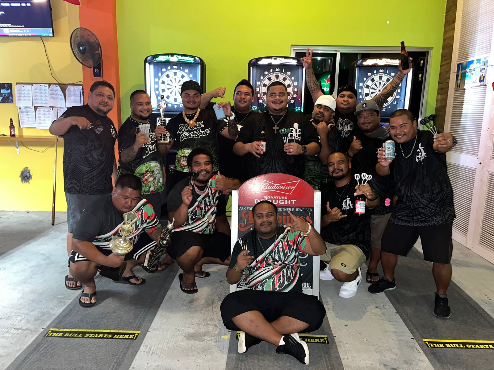 Last Shot NoSkillJustLuck and Oleai Aimrite pose for  a photo after their game in the Latte Stone Tuesday “B” Division of the SEDA Bud Light Dart League at Last Shot Bar.