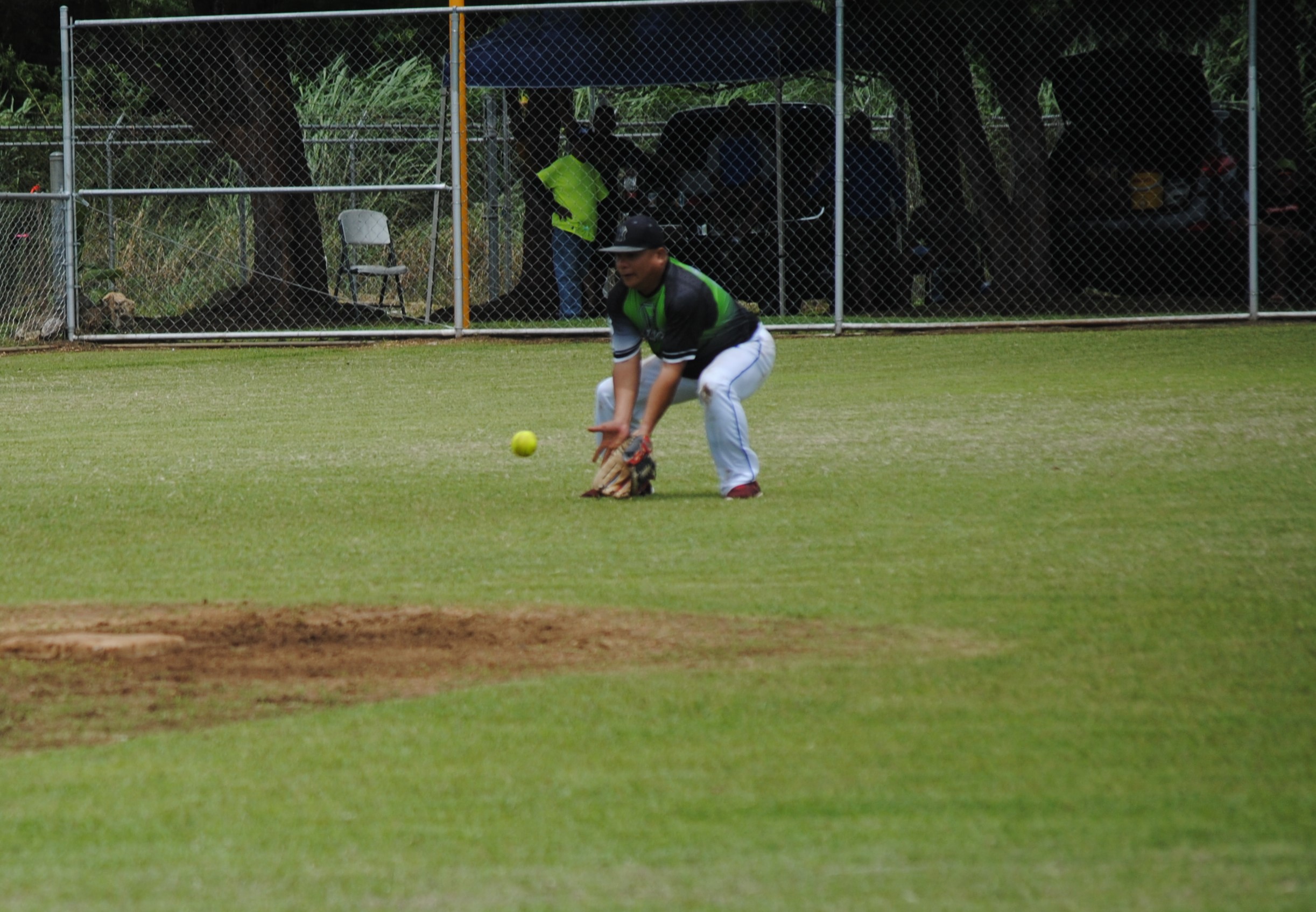 Tokahao's Jerome Delos Santos catches the grounder.
