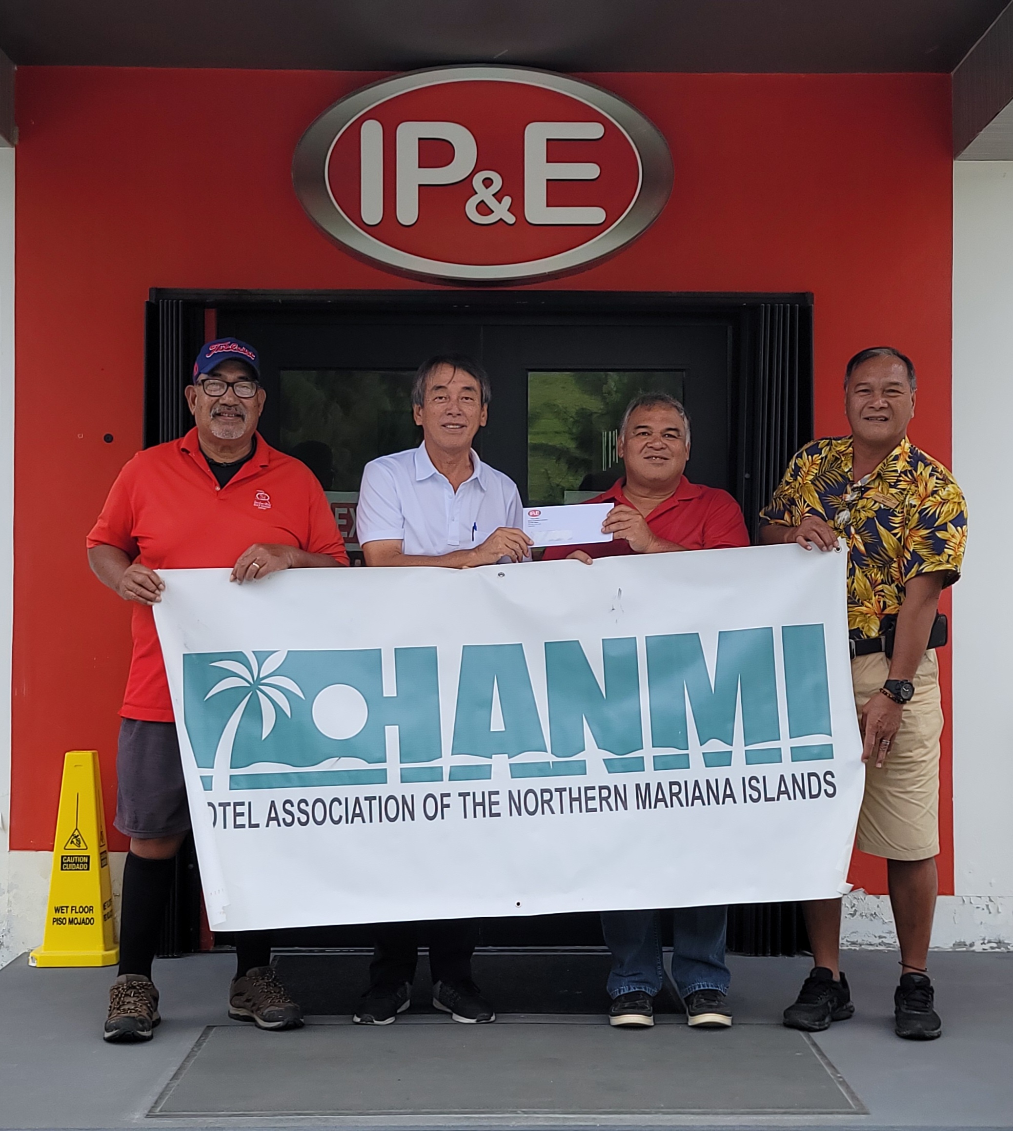 IP&E Commercial Fuel Accounts Manager Ron Benavente, second, right, donates $750 on August 31, 2022, at the company office in Lower Base, Saipan, as a Superior Sponsor for the 20th Annual HANMI Charity Classic Golf Tournament. From left, tournament committee member Tony Satur, tournament committee chairman Juko Ishikawa, Benavente and tournament committee member Max Concepcion.