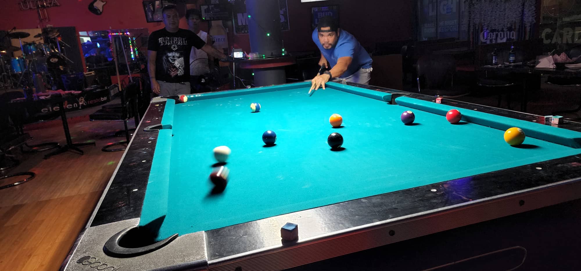 9 Eleven Rebels 2's Robert Sanciangco connects the corner shot during a Thursday Division game of the SBA Budweiser Open 8-Ball League at 9 Eleven Restobar.