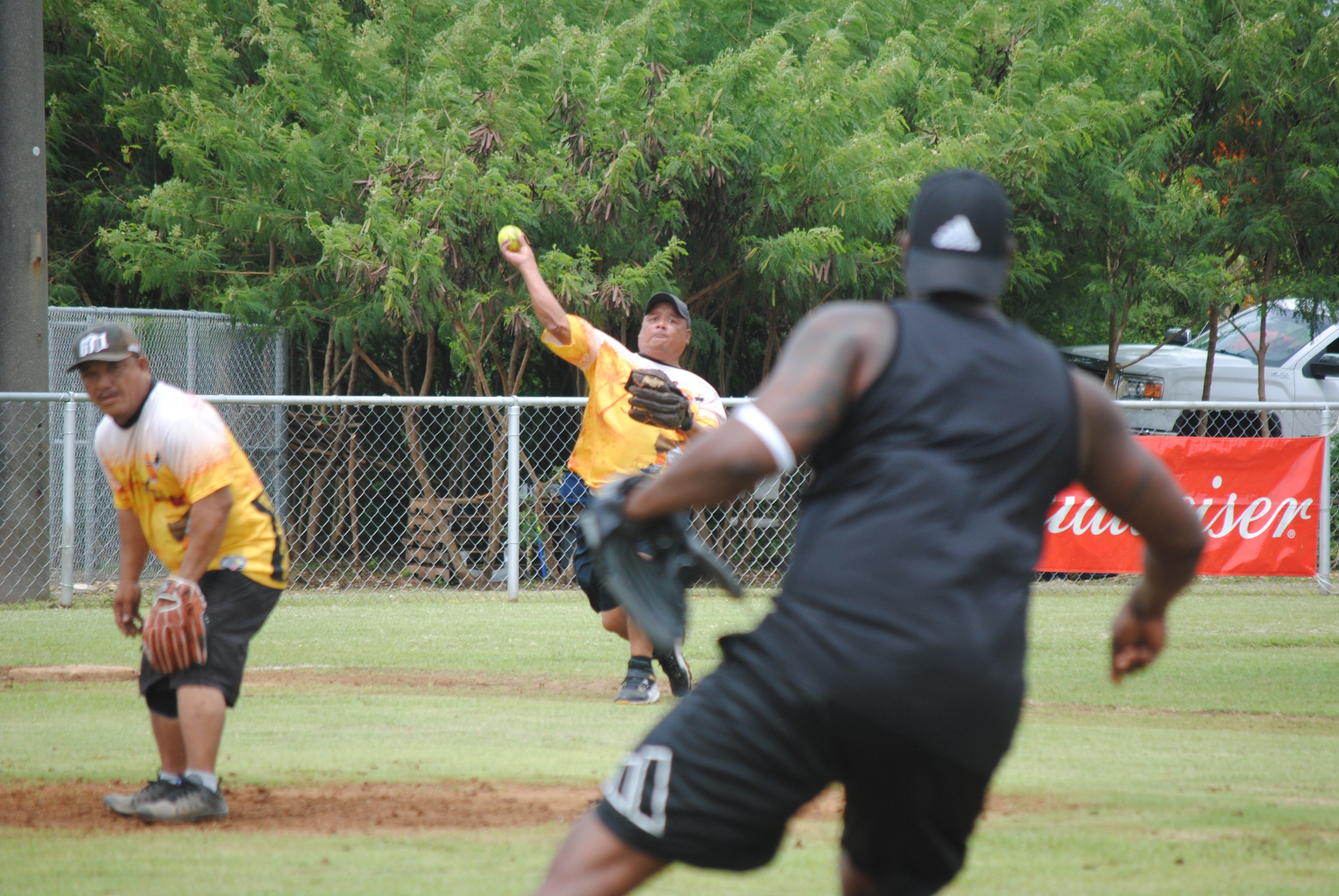 Hagu Lamun third baseman John Acosta throws to first baseman Deshawn Reign for the out.