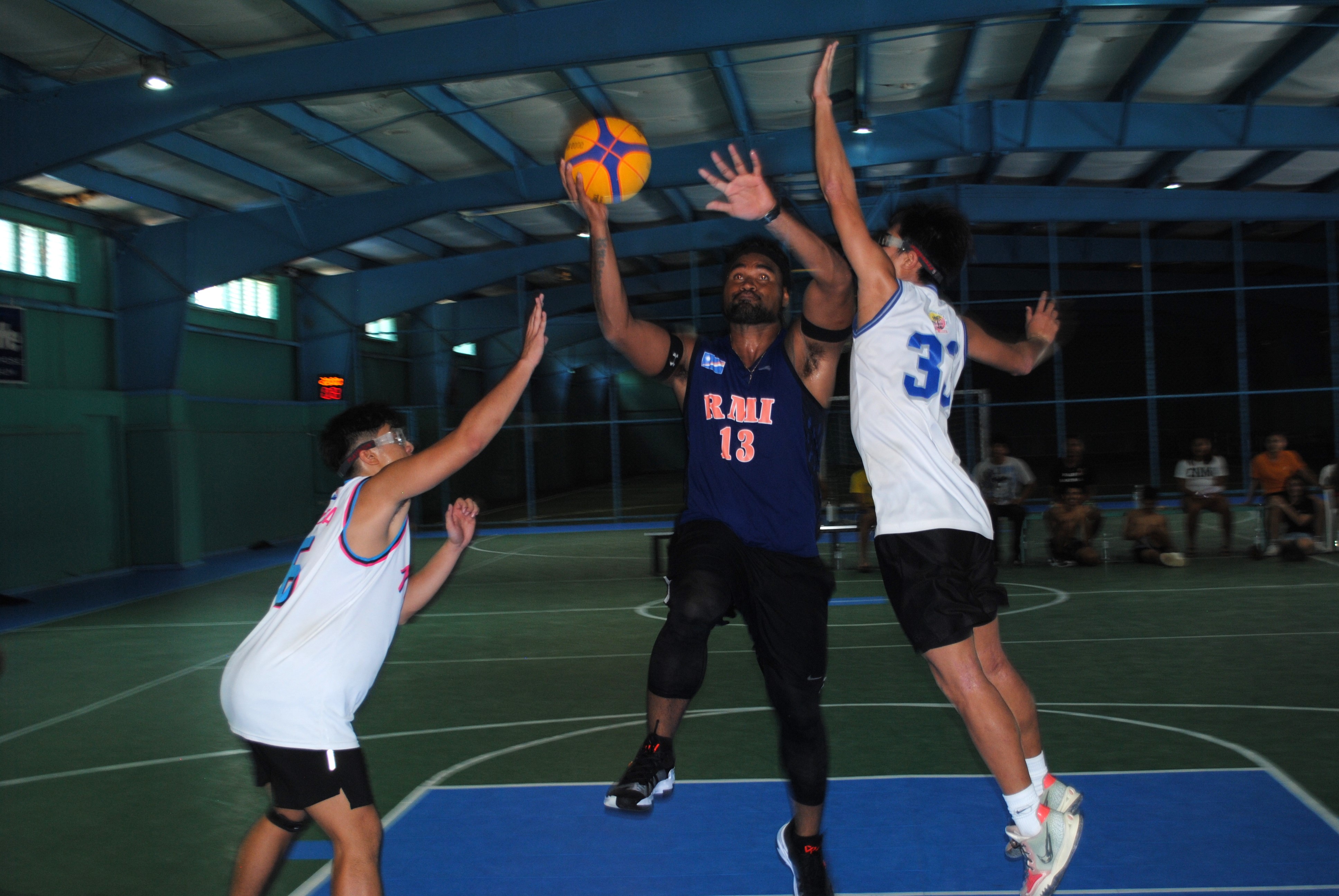 Kelvin Fitial protects the ball as he rises for the finish.