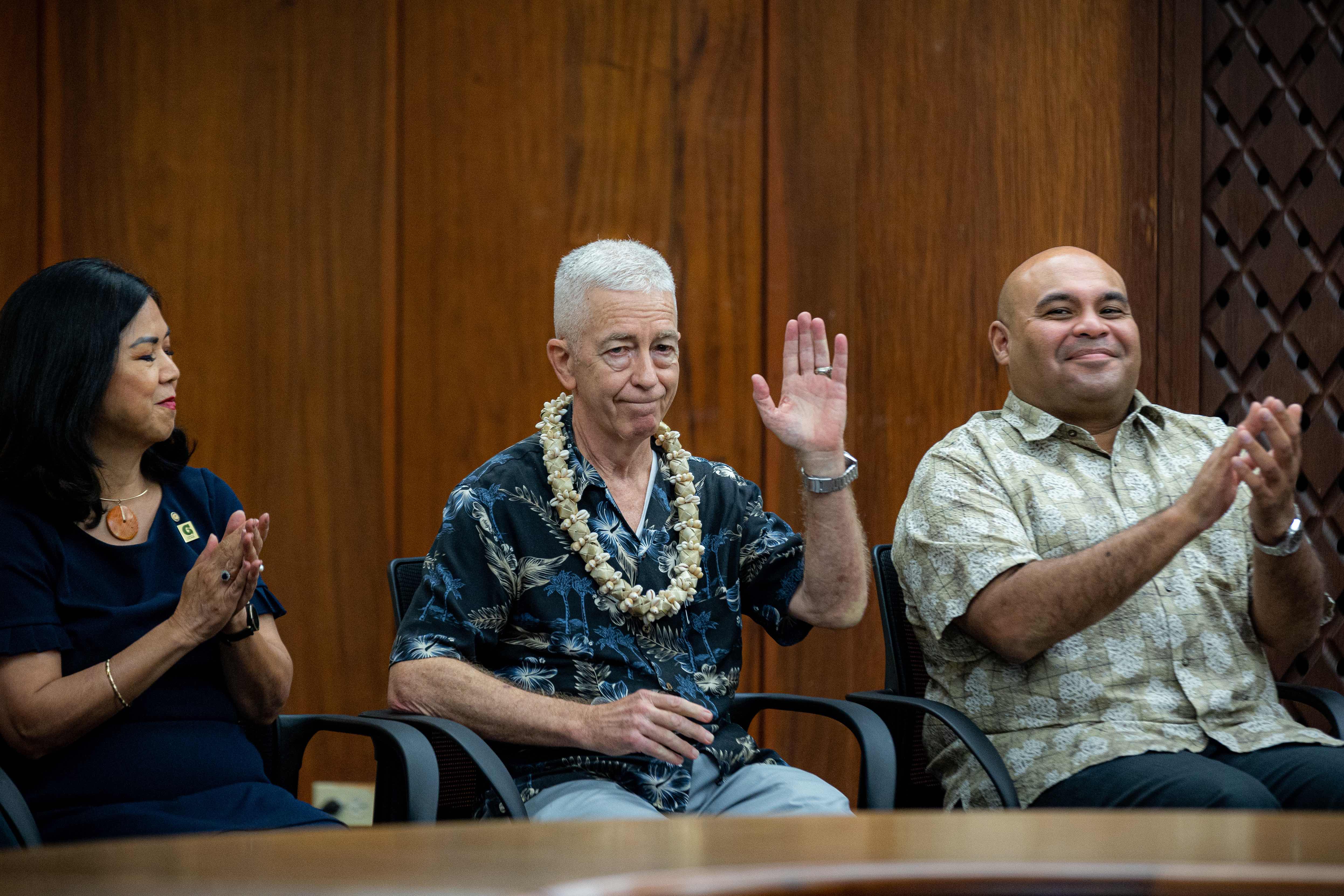 John W. Jenson, center, director and chief geologist of the Water and Environmental Research Institute of the Western Pacific at the University of Guam, responds to applause at a Sept. 26 ceremony giving him the Ancient Order of the Chamorri Award — the highest honor the Guam governor can give. The event was held at the Ricardo J. Bordallo Governor’s Complex in Adelup. To his left is acting UOG President Anita Borja Enriquez and acting Gov. Josh Tenorio, right. 