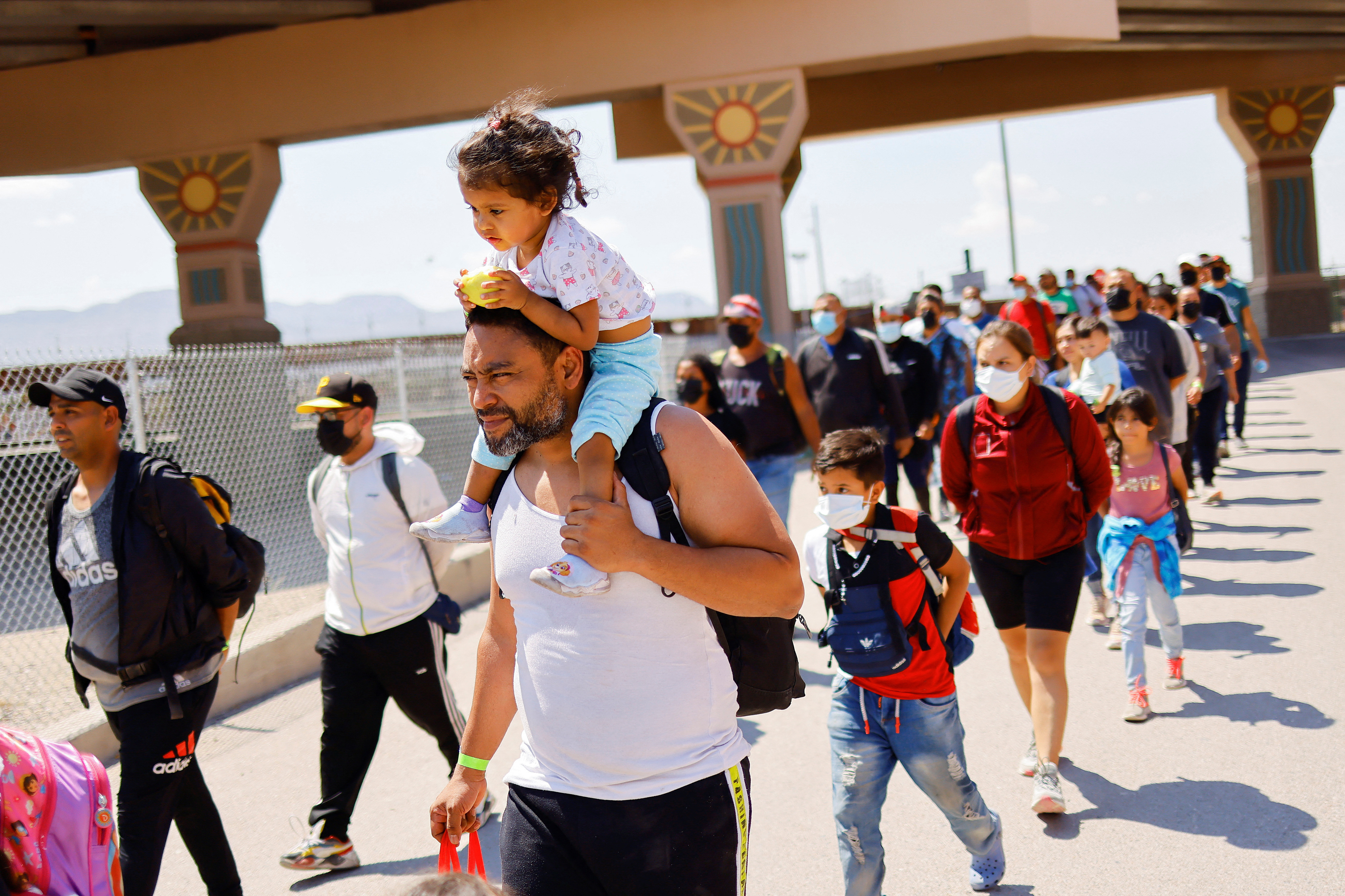 Migrants walk after being detained by U.S. Border Patrol agents after crossing into the United States from Mexico to turn themselves in to request for asylum, in El Paso, Texas, Sept. 12, 2022.