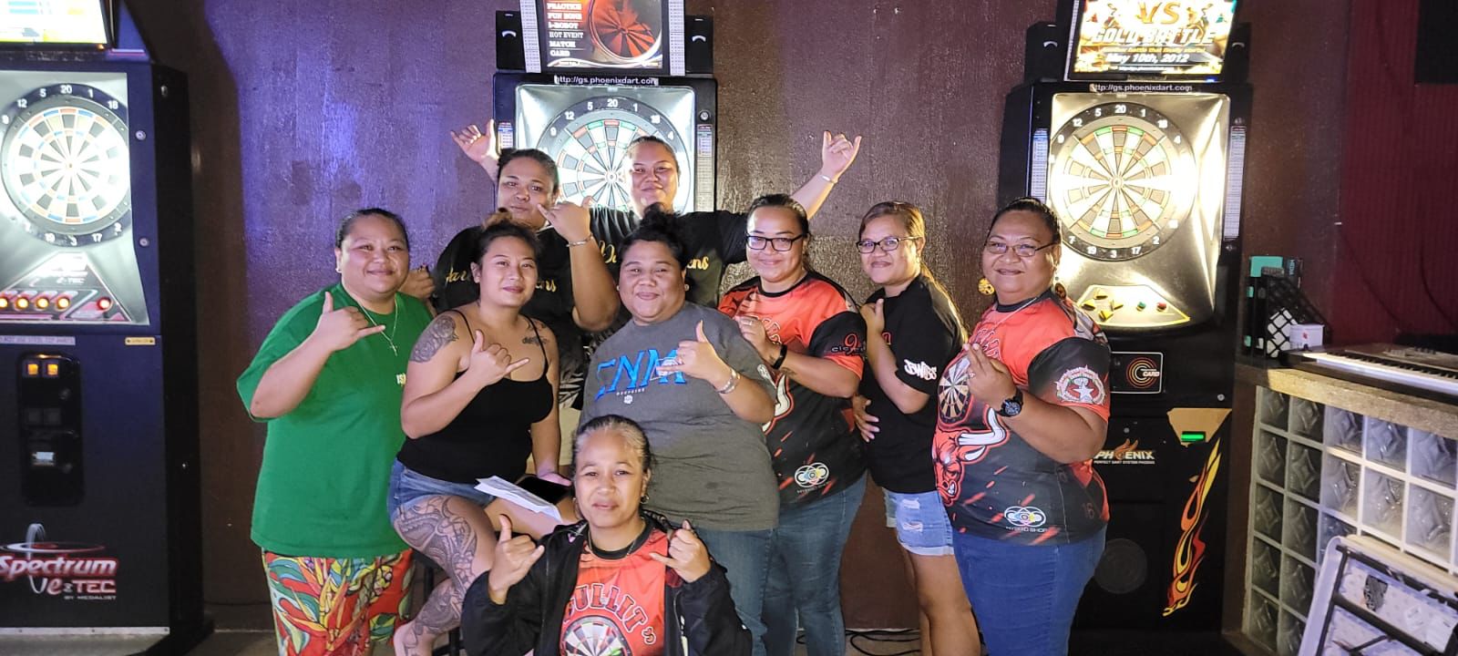 The Jonny's Darty Queens and 9 Eleven Chickazz Bull-It pose for a photo after their match Monday in the Ladies Division of the SEDA Bud Light Dart League at Jonny's Bar.