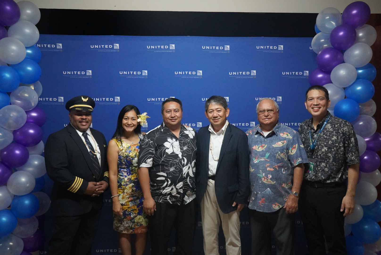 The United Airlines team poses for a photo with Gov. Ralph DLG Torres, first lady Diann T. Torres, and Commonwealth Ports Authority board vice chair Roman T. Tudela.