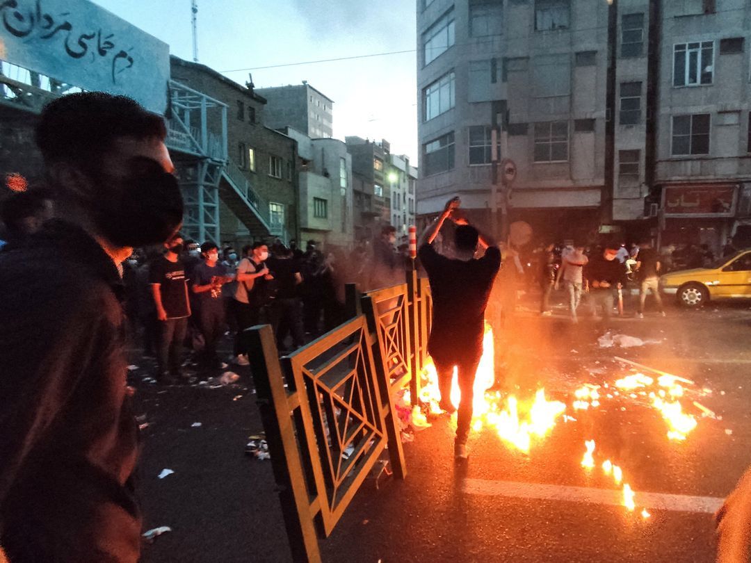 People light a fire during a protest over the death of Mahsa Amini, a woman who died after being arrested by the Islamic republic's "morality police," in Tehran, Iran Sept. 21, 2022.