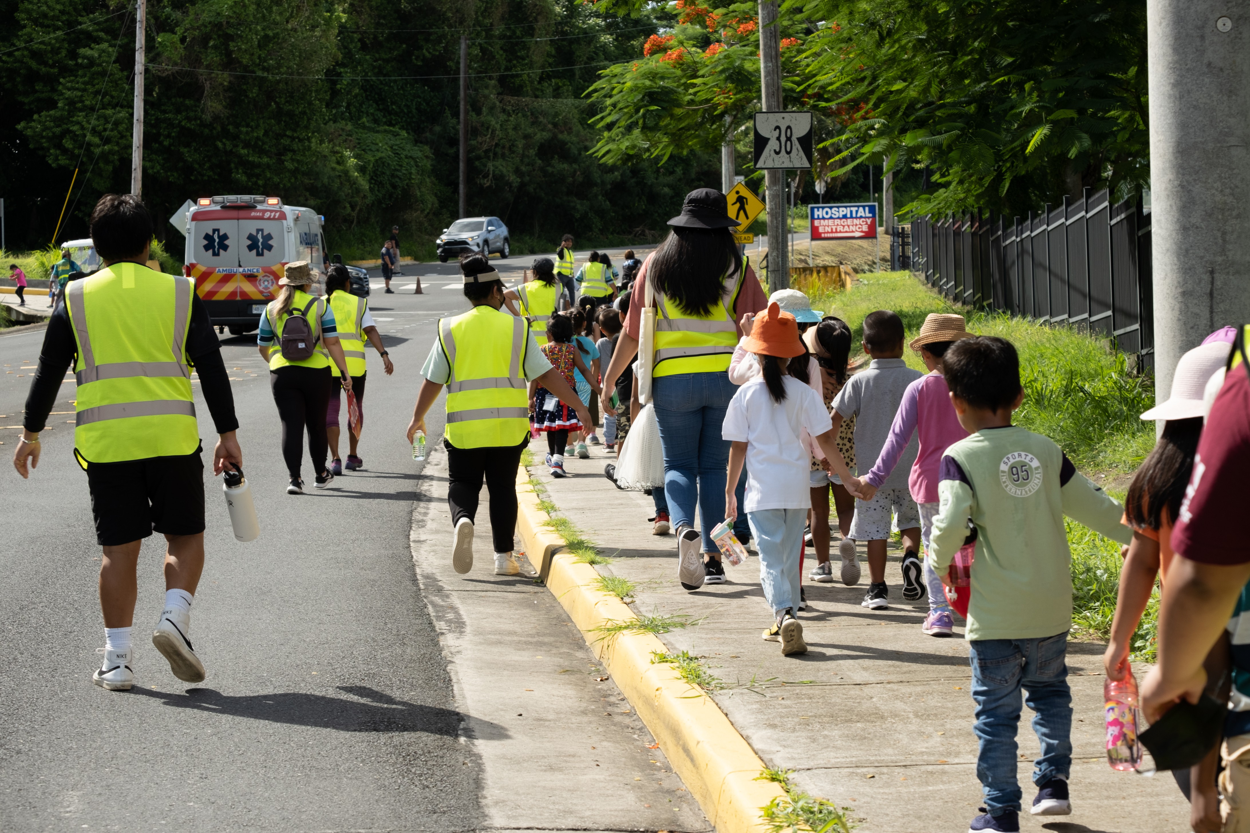 GES students are escorted by PSS personnel and other local authorities to the CHCC parking lot, their designated evacuation zone.