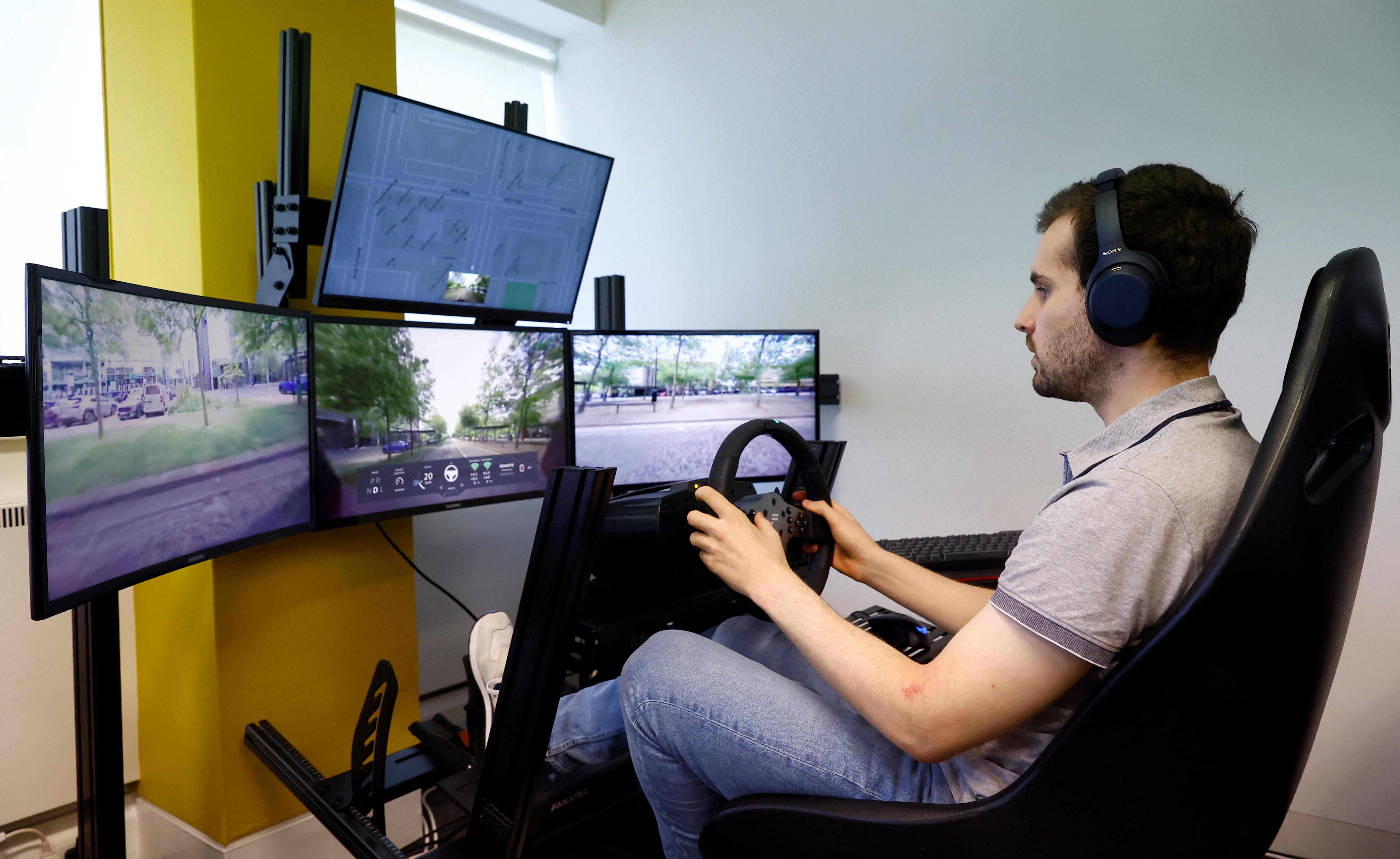 An operator controls a Fetch driverless car from the office of Imperium Drive, during driverless car trials, in Milton Keynes, Britain, June 8, 2022.