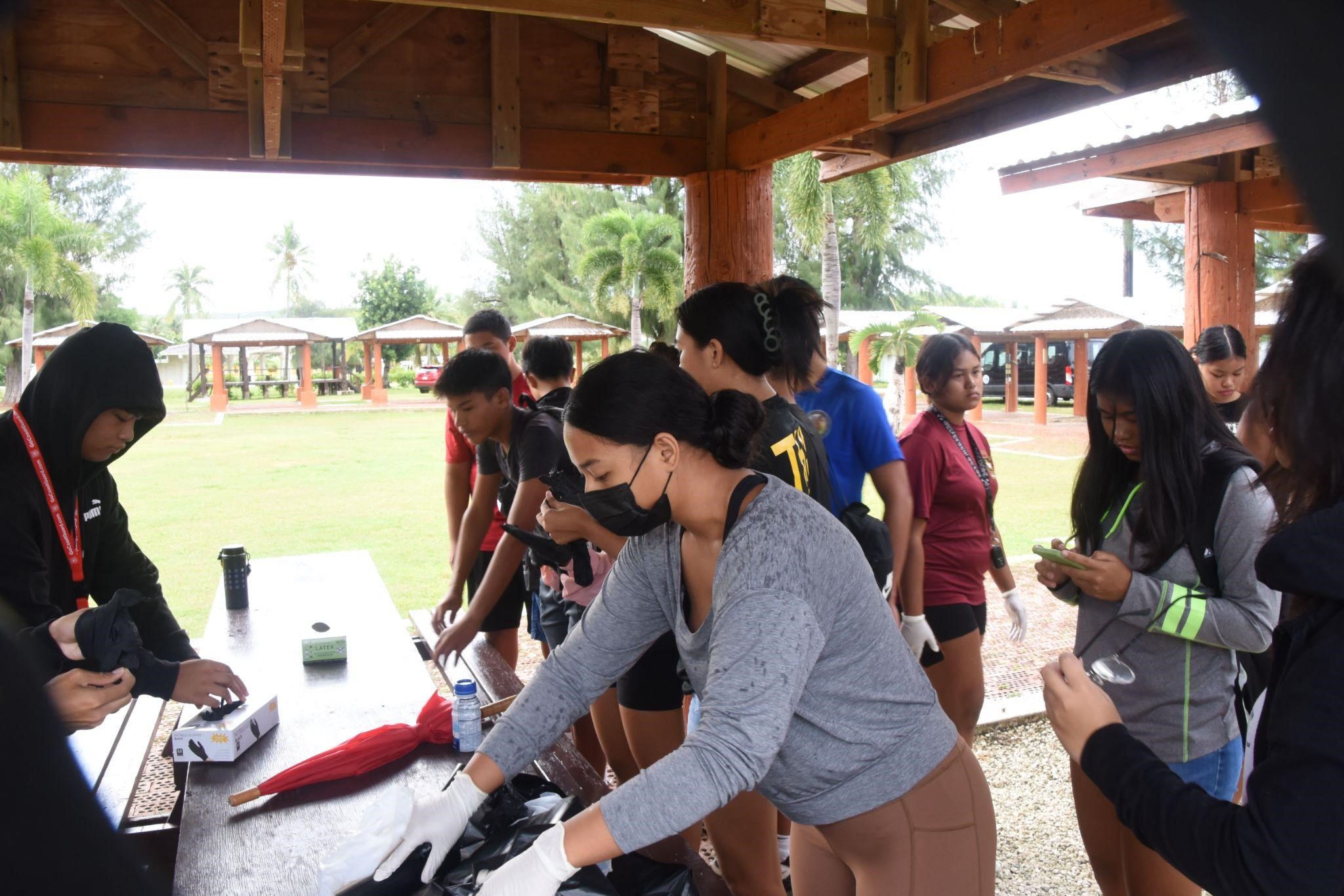 Stallion Battalion cadets prepare for their cleanup at the Tinian Fiesta Grounds