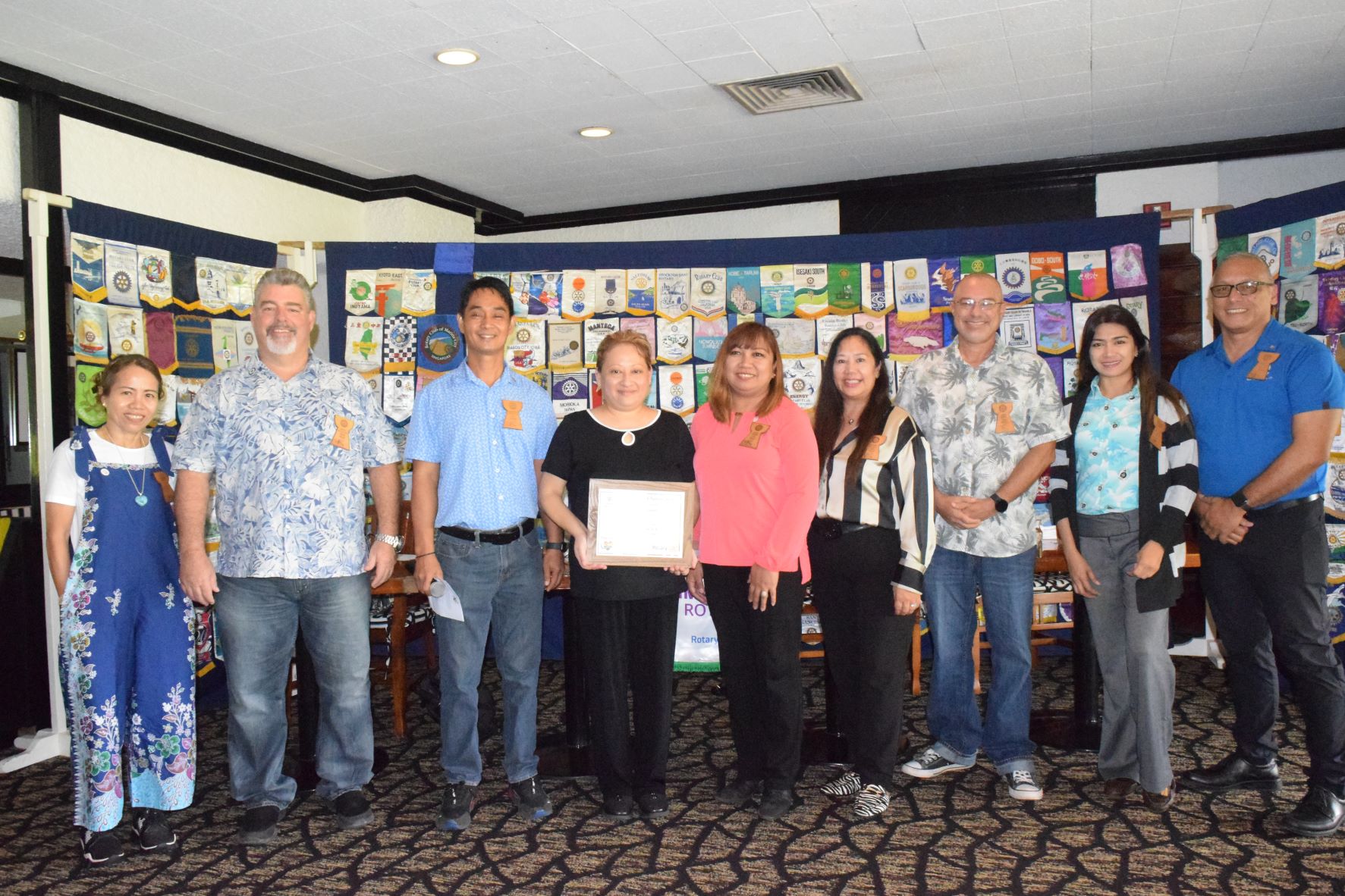 Public School System Career & Technical Education Program Director Jessica Barcinas Taylor, Ed. D. holds the certificate of appreciation as she poses for a photo with Rotary Club of Saipan's officers during its luncheon meeting at Hyatt Regency Saipan's Giovanni Restaurant on Tuesday. From left, Rotary's President-elect Irene Holl, Sgt.-at-Arms Marion Valentino, Rotary President Wendell Posadas, Taylor, Rotary Vice President Jessy Loomis, Secretary Joann Aquino, Club Service Director Mary Grace Bautista and Treasurer Charles Cepeda.