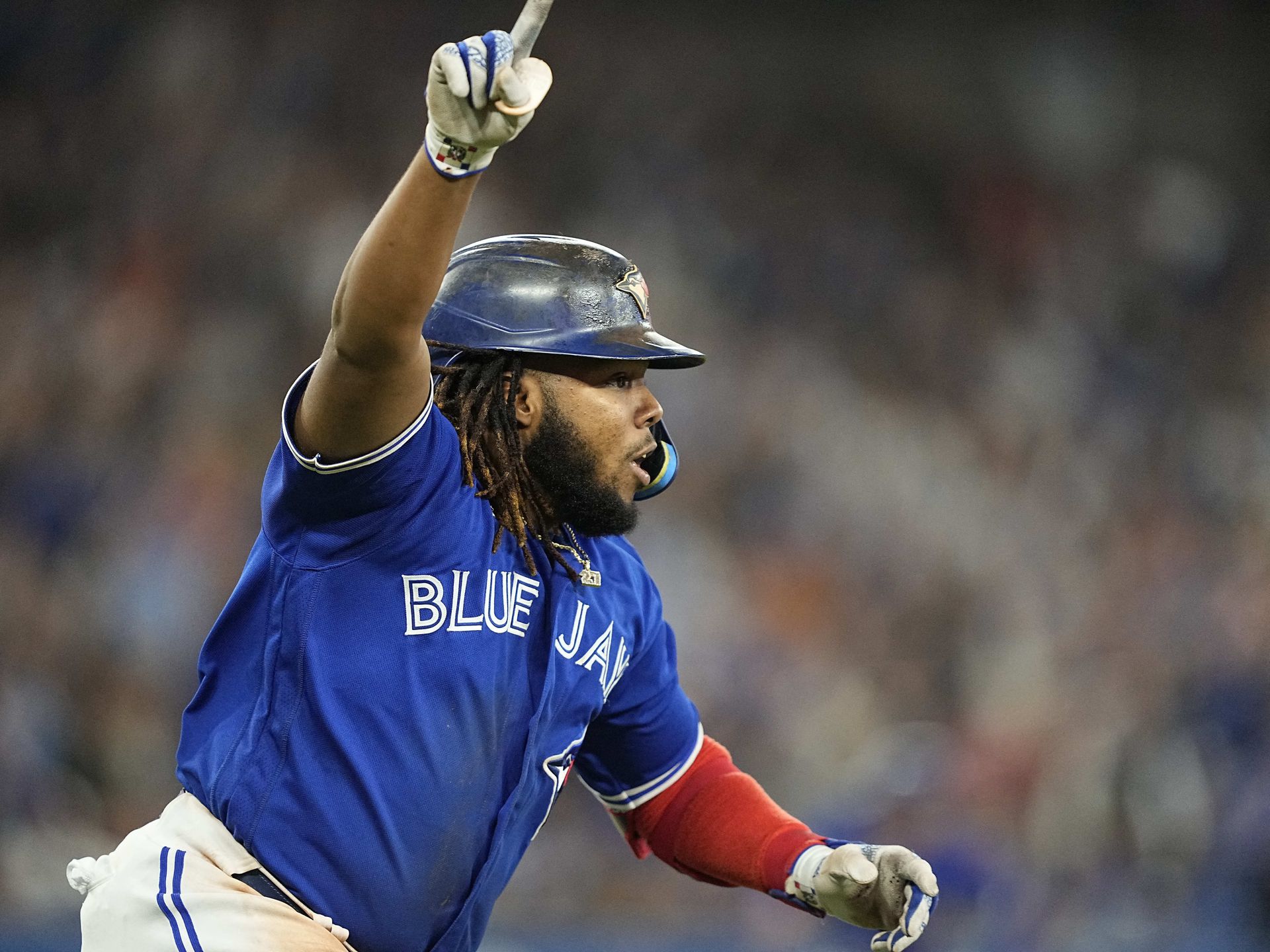Toronto Blue Jays first baseman Vladimir Guerrero Jr. (27) celebrates after hitting a walk-off single against the New York Yankees during the tenth inning at Rogers Centre in Toronto, Ontario, Canada on Sept. 26, 2022.