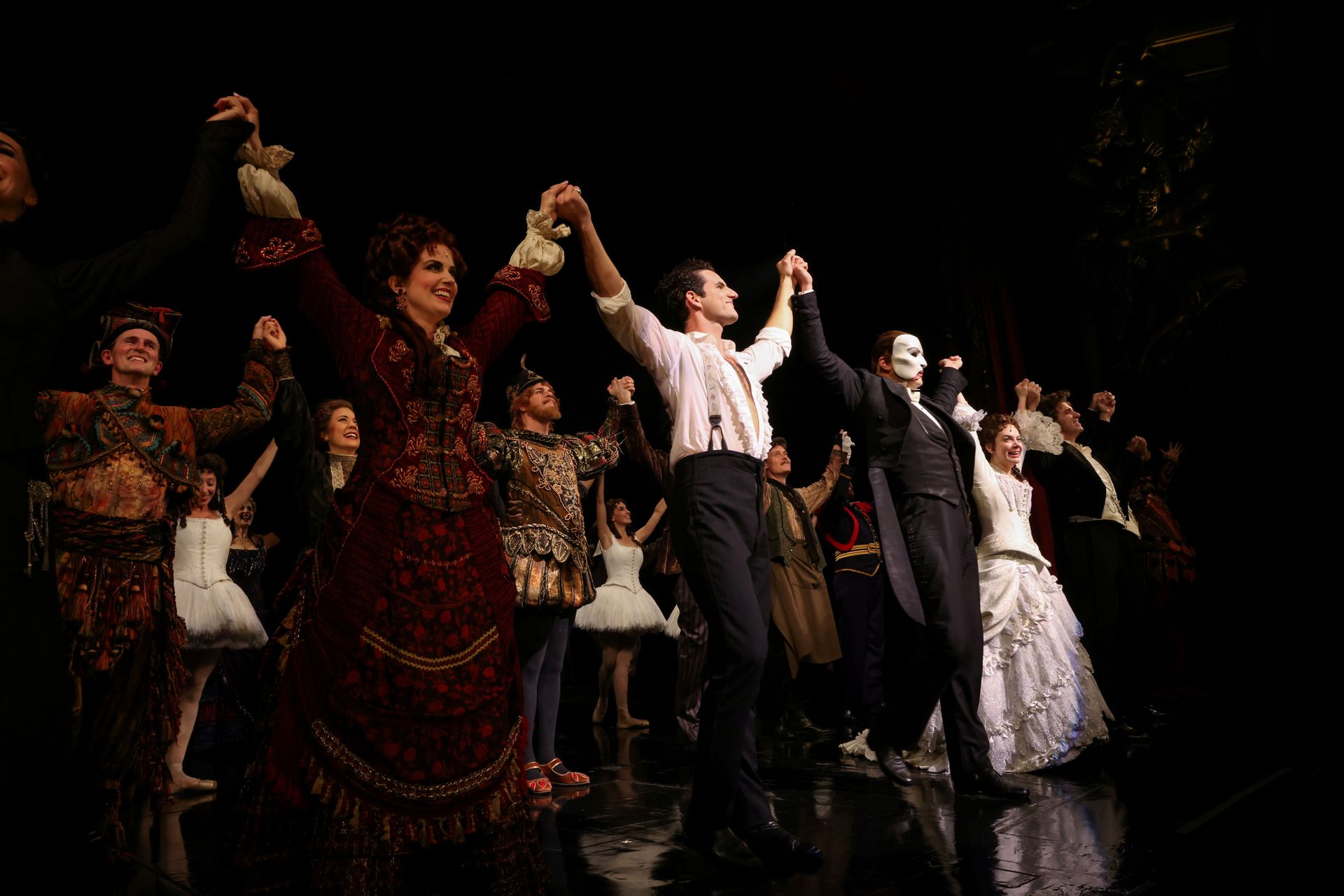 Cast members stand on the stage after performing on the re-opening night of "Phantom of the Opera" at the Majestic Theater in New York City, Oct. 22, 2021.