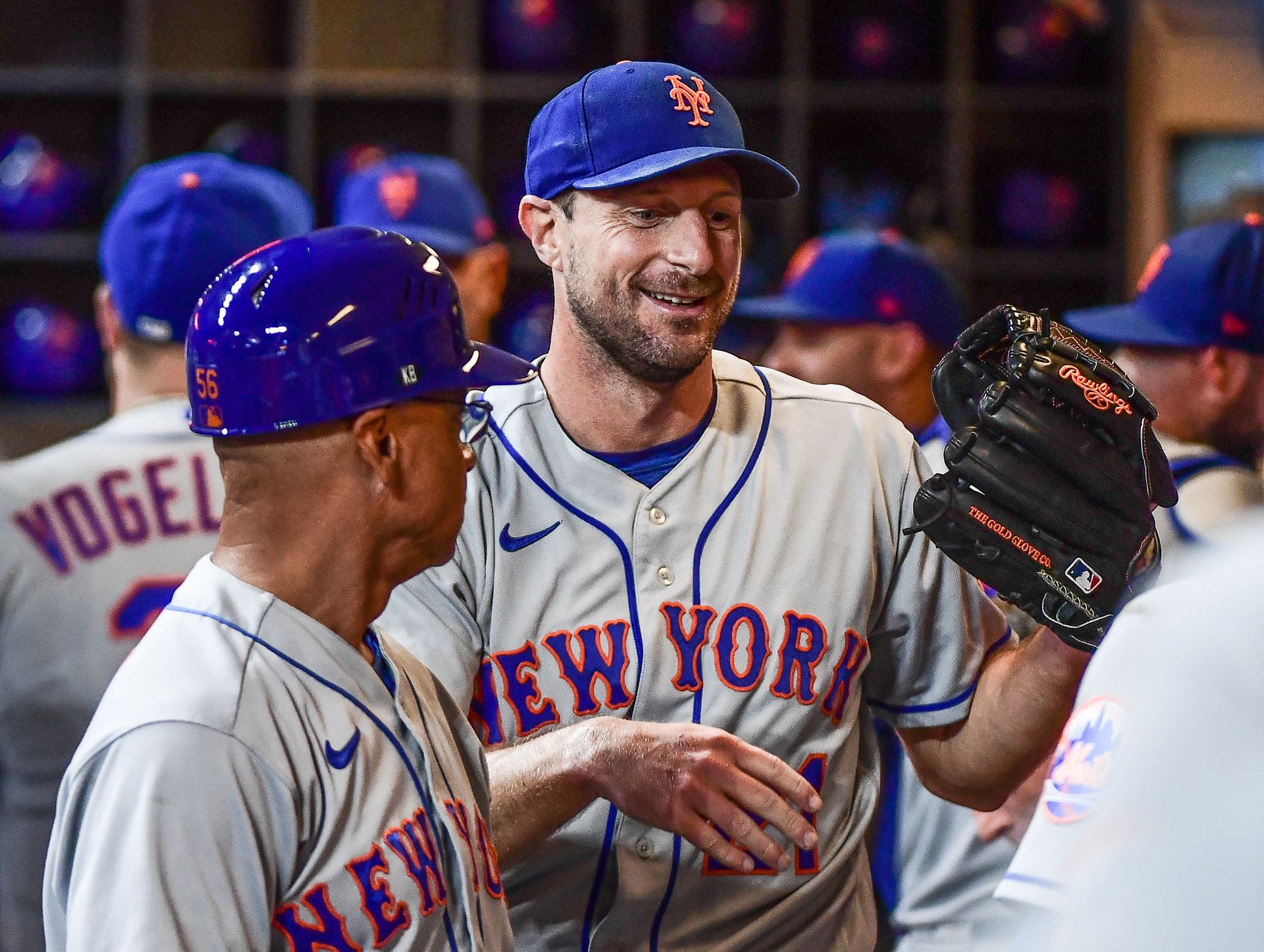 New York Mets pitcher Max Scherzer (21) is greeted in the dugout after pitching six scoreless no-hit innings against the Milwaukee Brewers at American Family Field in Milwaukee, Wisconsin, Sept 19, 2022.