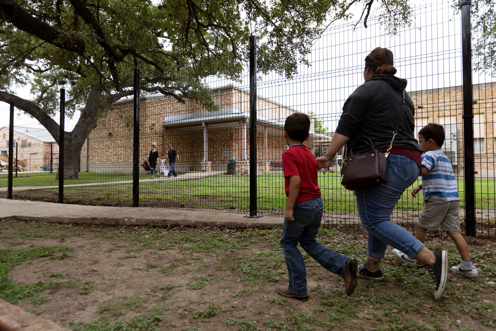 Families arrive at Uvalde Elementary School for a Meet the Teacher event before the start of the new school year following the mass shooting at Robb Elementary in Uvalde, Texas, Aug. 30, 2022.