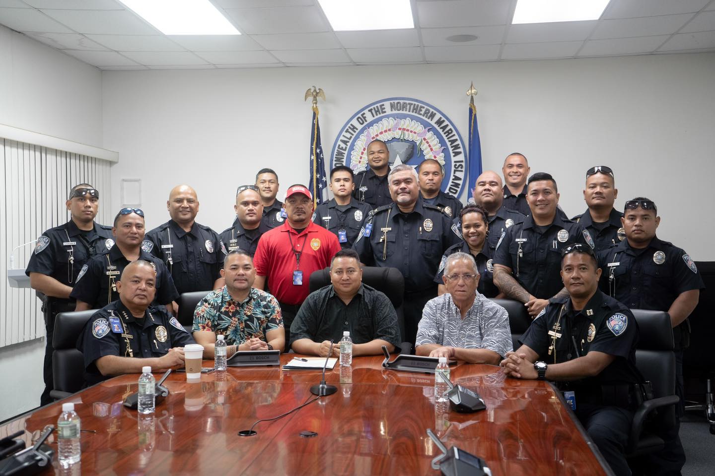 Governor Ralph DLG Torres, center seated, poses for a photo with the Commonwealth Ports Authority ports police, Senate Floor Leader Vinnie F. Sablan and Rep. Joseph Leepan T. Guerrero in the governor's conference room on Tuesday morning.