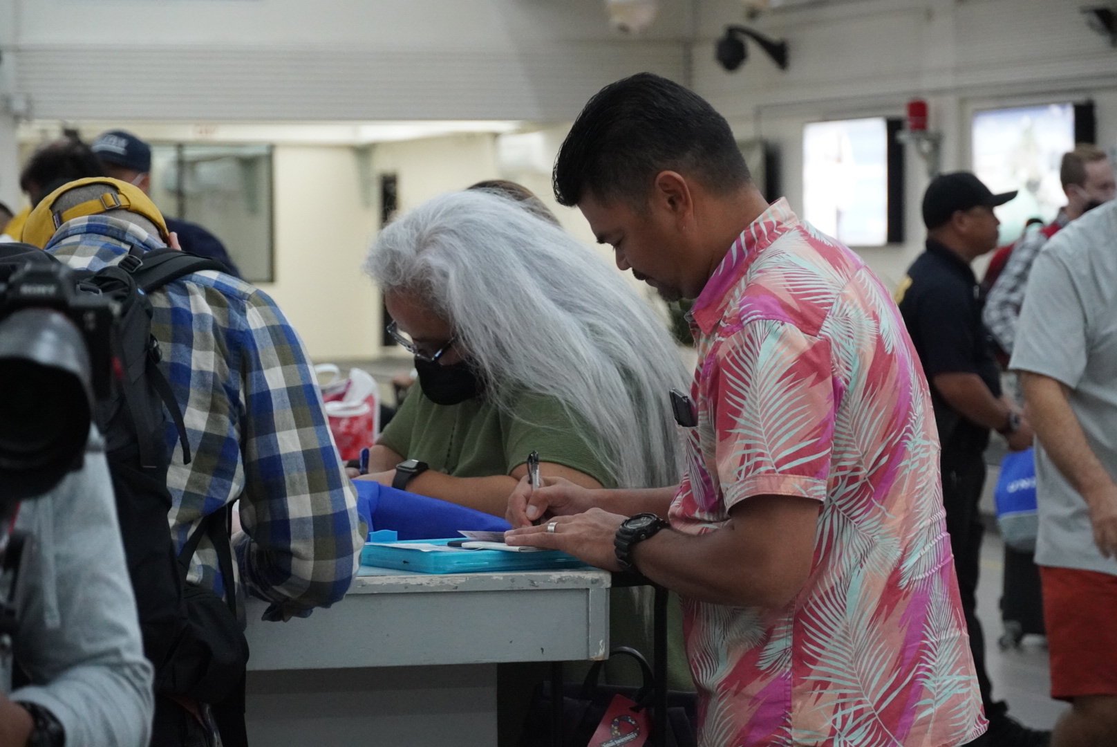 Rep. Roy Ada and Marianas Visitors Authority board chair Viola Alepuyo fill out customs forms at the Francisco C. Ada/Saipan International Airport arrival terminal. Both Ada and Alepuyo were part of the CNMI delegation who traveled to and from Japan for the inaugural flight ceremonies.