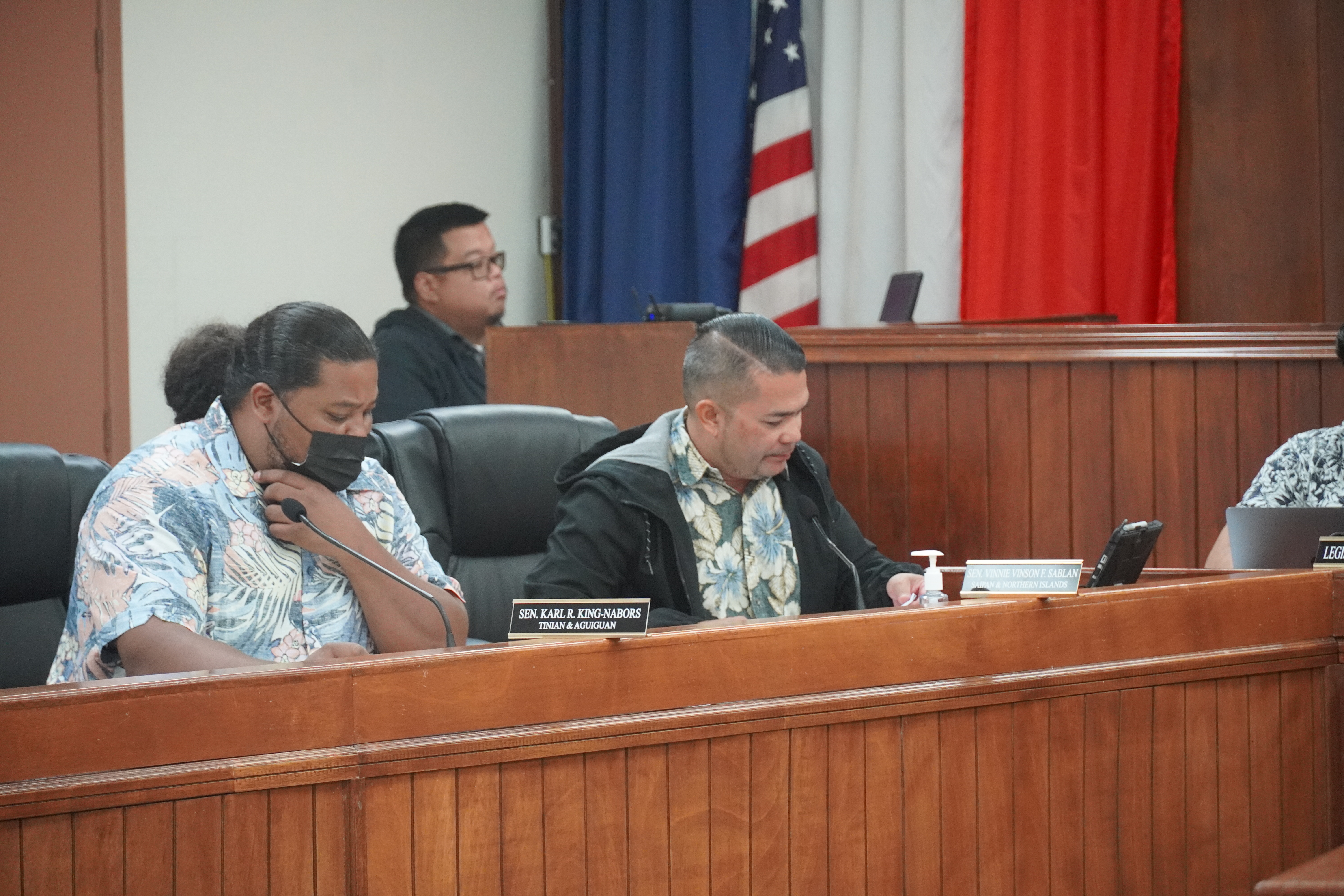 Sen. Karl R. King-Nabors and Senate Floor Leader Vinnie Vinson F. Sablan review documents during the budget hearing.