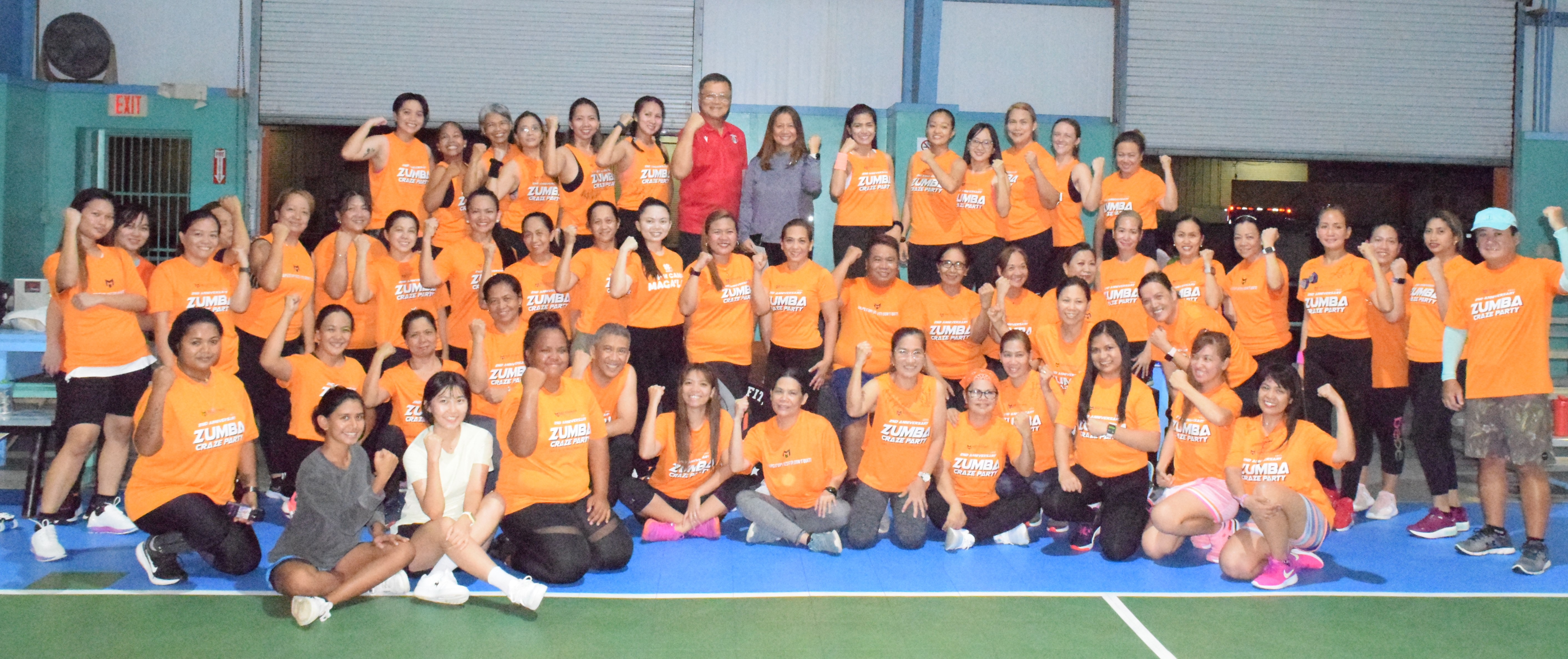 Tan Holdings CEO and President Jerry Tan and Tan Siu Lin Foundation Executive Director Merlie Tolentino pose for a photo with M2 Fitness officers and members after the presentation of a $2,000 donation at the TSL Sports Complex on Friday.
