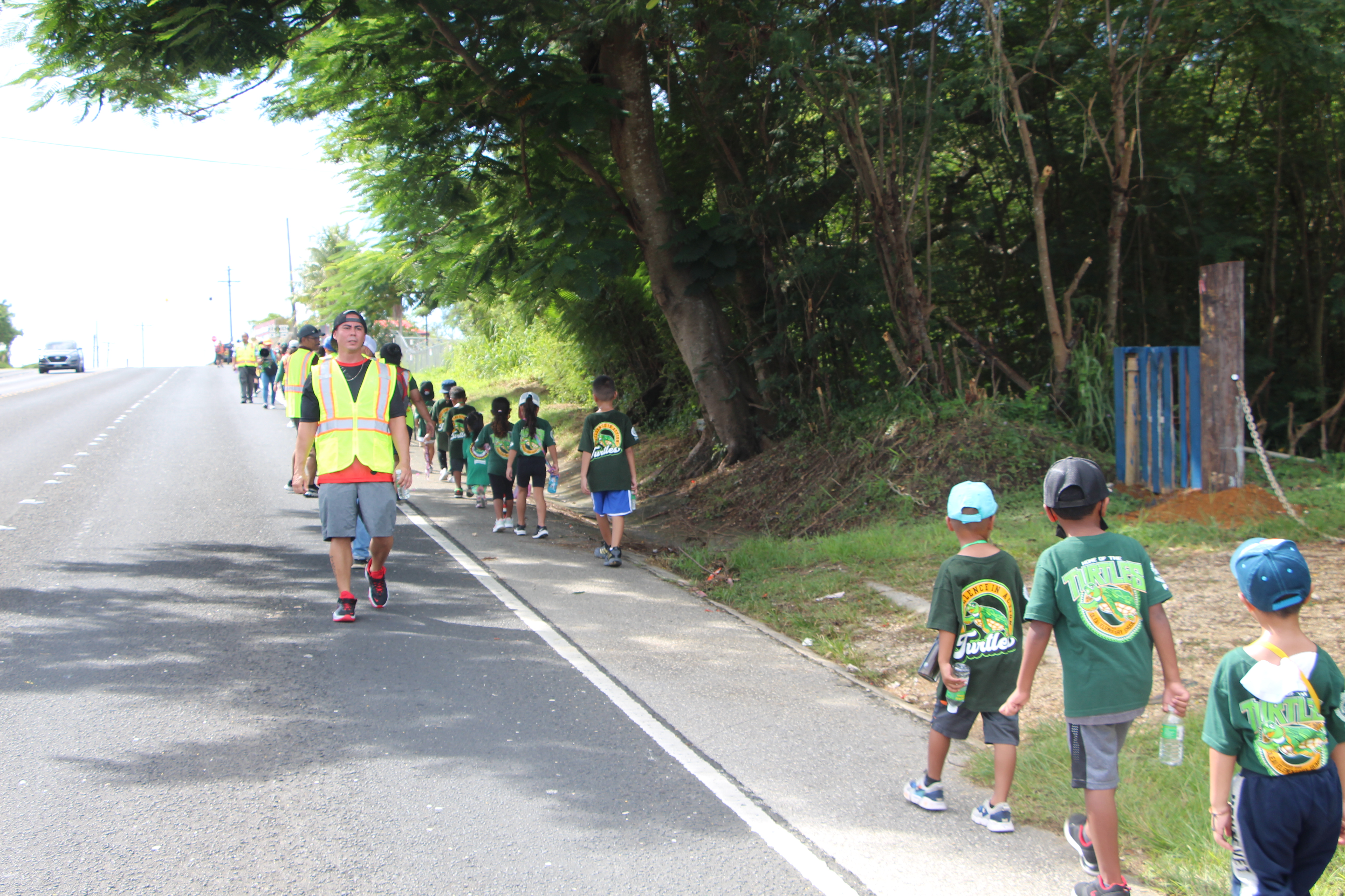 Oleai Elementary School students head to their designated safe zone, Northern Marianas College on As Terlaje hill, Tuesday, during a tsunami evacuation drill.